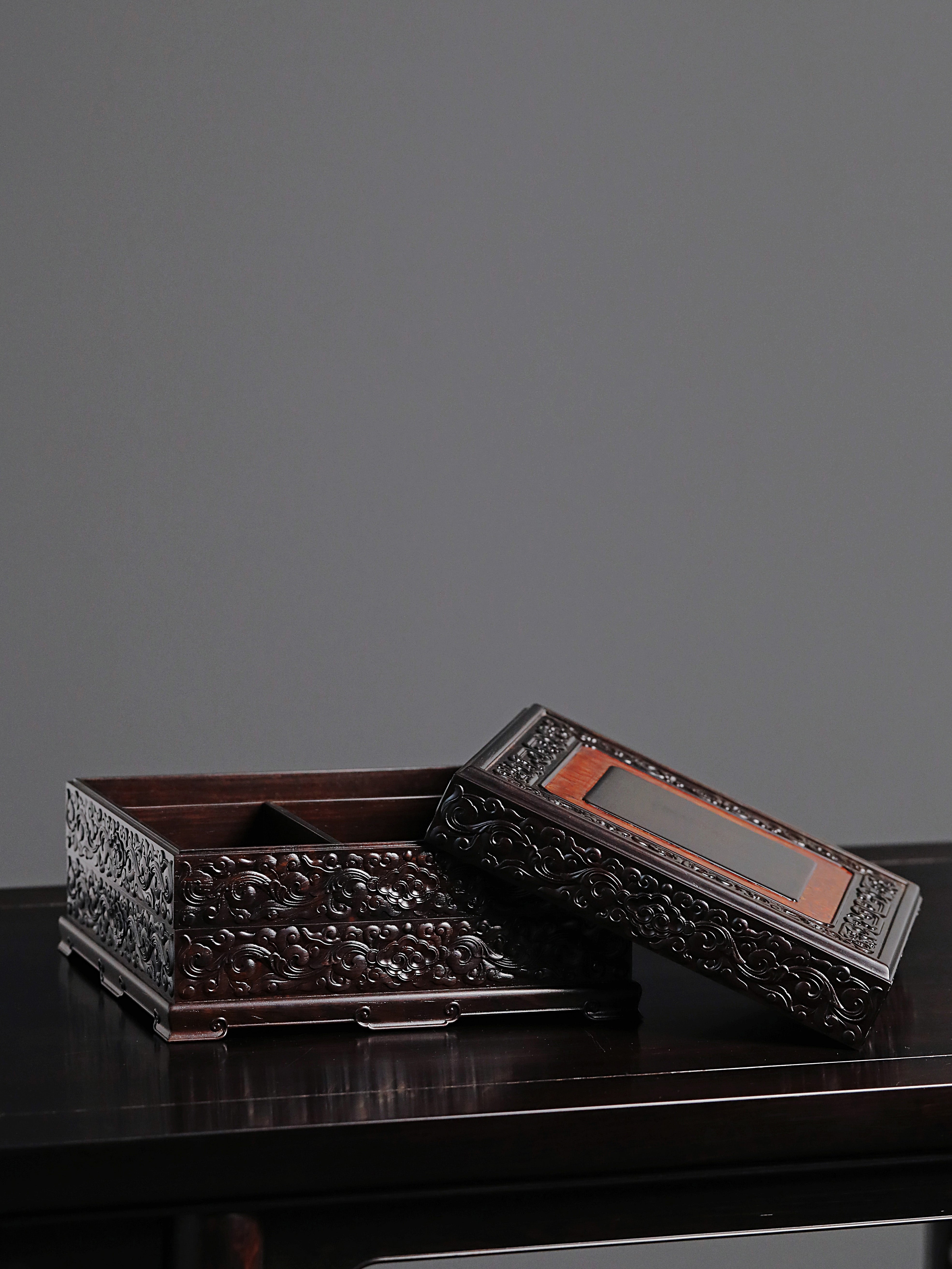 Purple sandalwood tea box with auspicious cloud and scroll patterns, three-tiered lid and four corners.