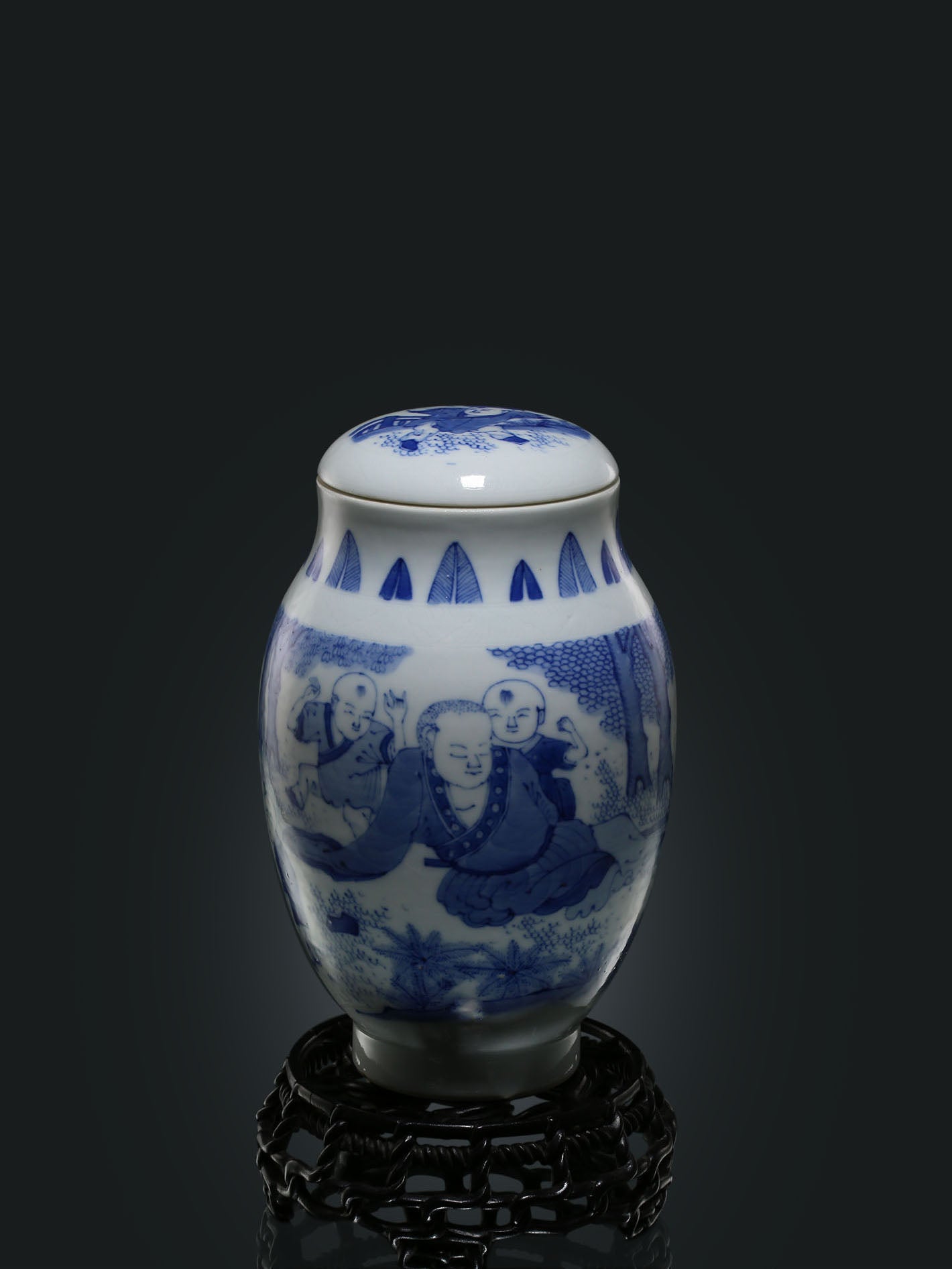 Blue and white porcelain tea canister with children playing design