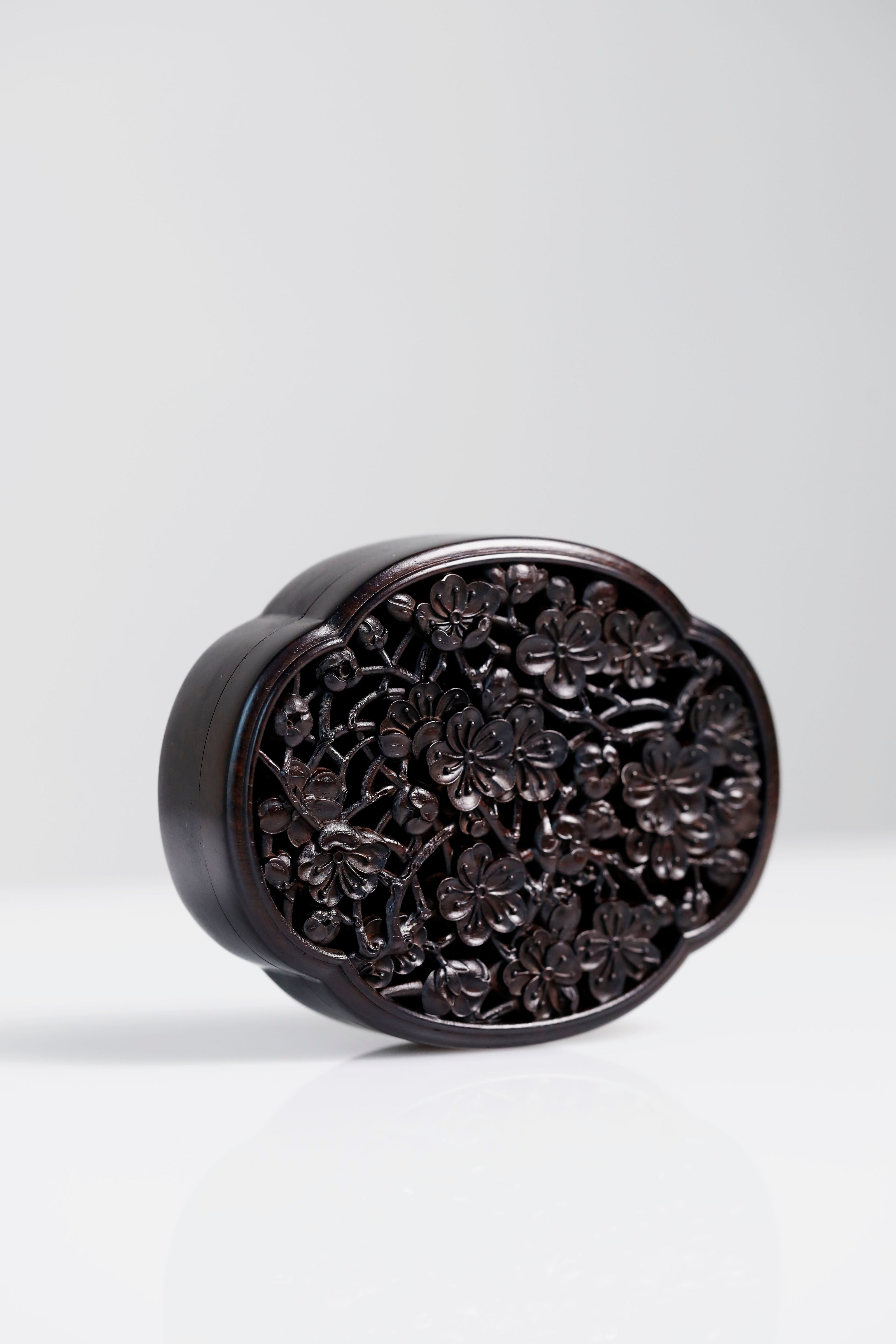 Purple sandalwood hollowed-out plum blossom shaped solid wood incense box