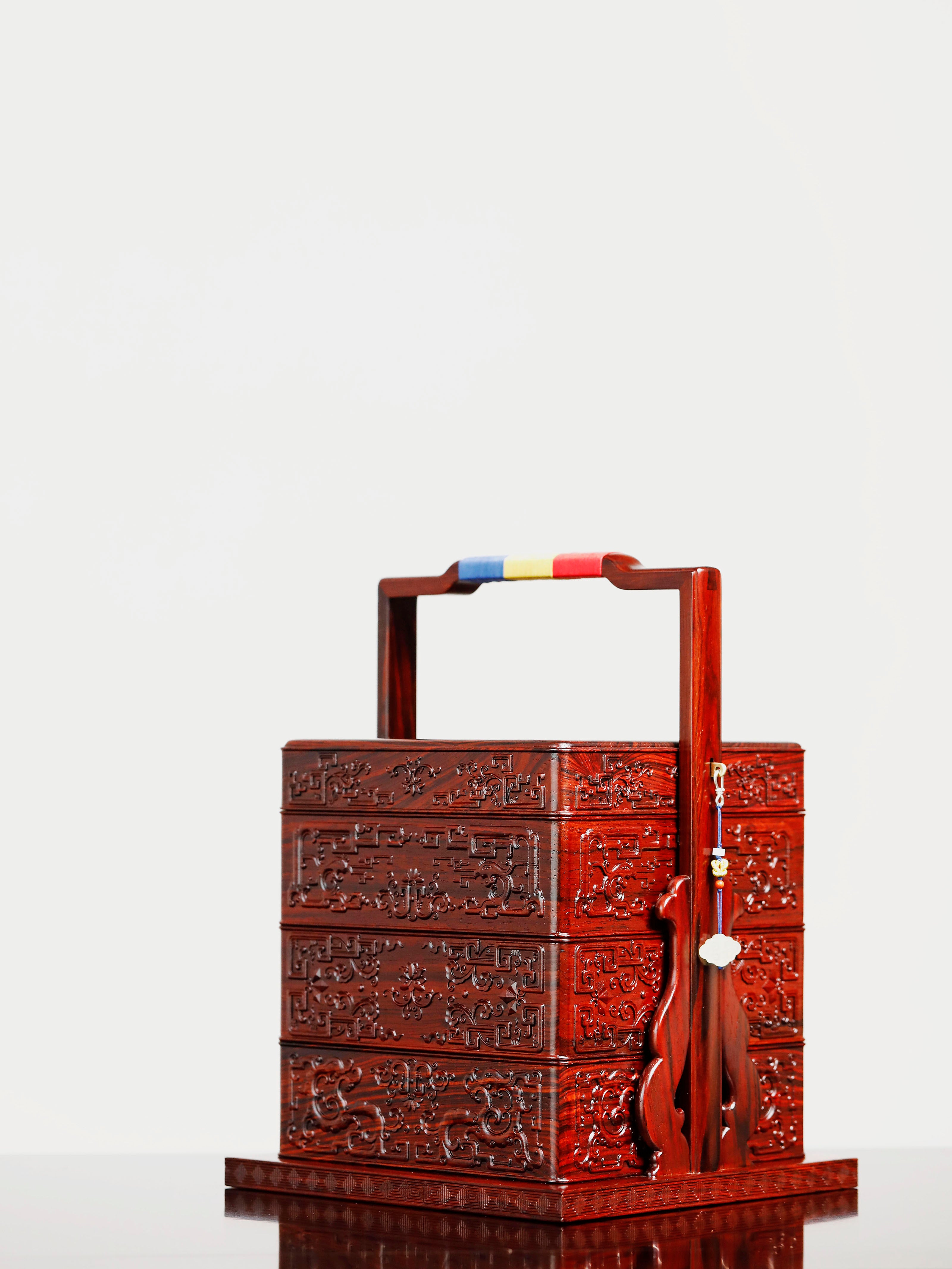 Rosewood square box with carved dragon and phoenix patterns