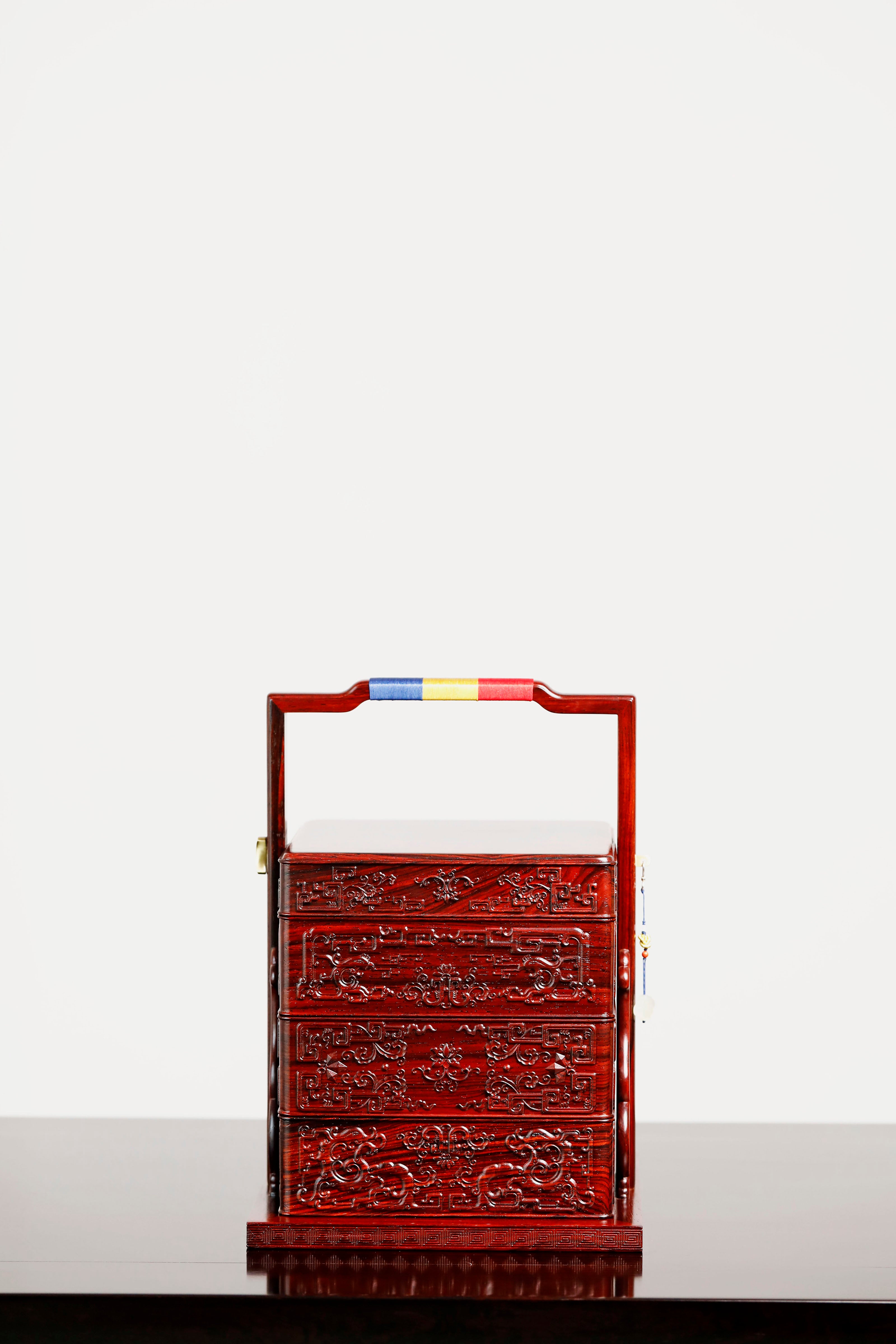 Rosewood square box with carved dragon and phoenix patterns