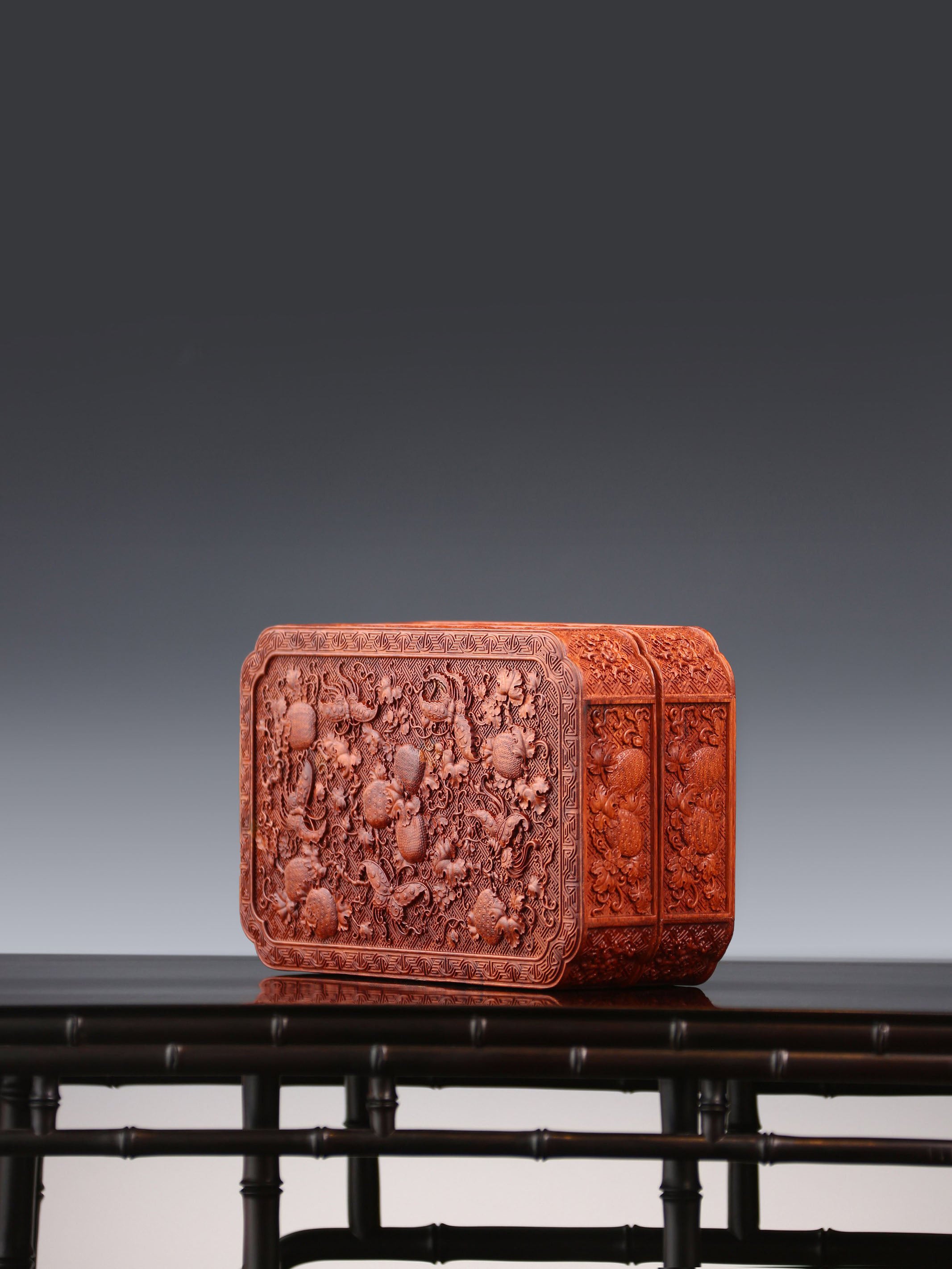 Tea box with full carving of lychee, butterfly, and dragon patterns