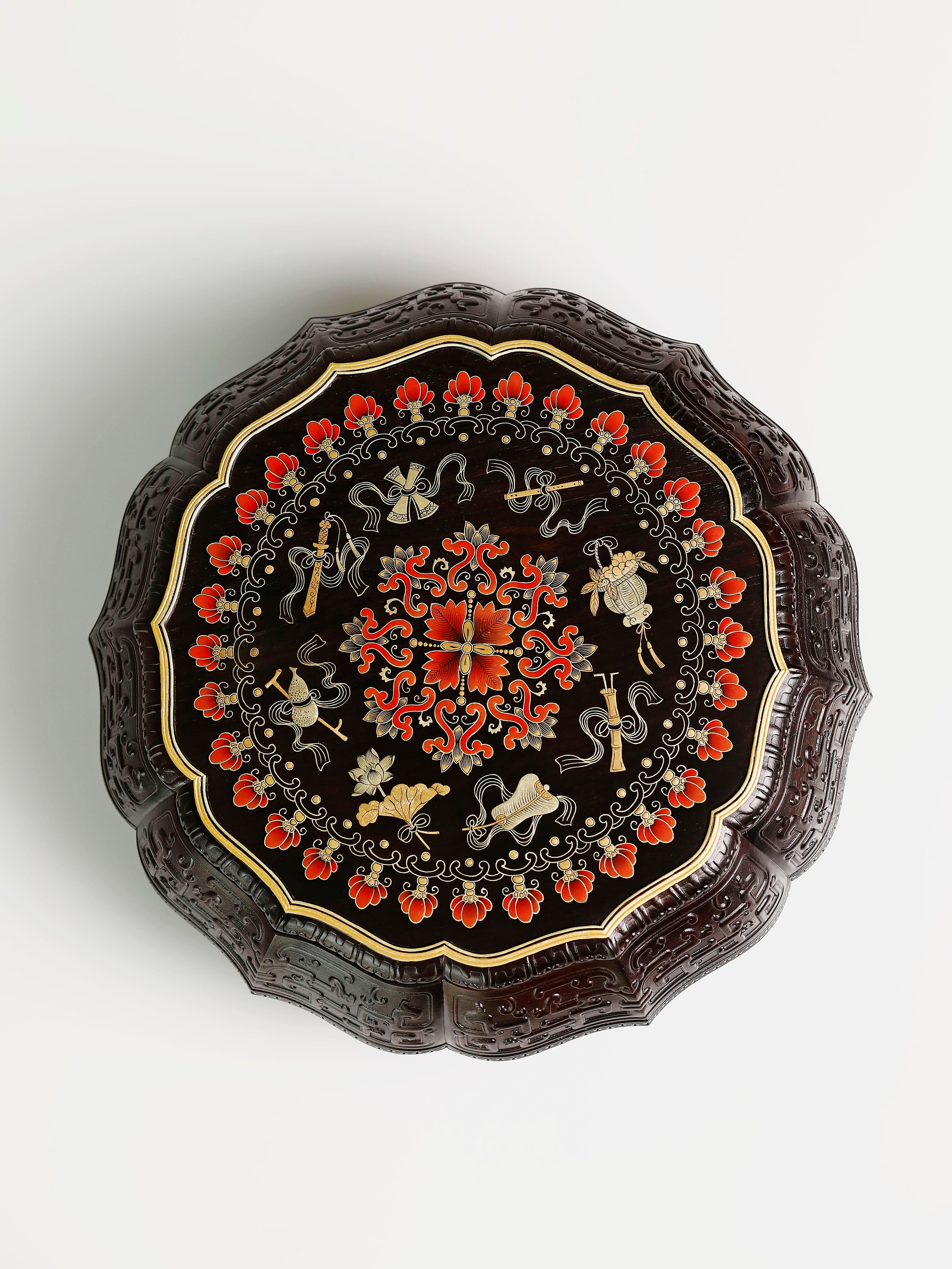 Purple sandalwood twelve-cornered fruit box with gilded Eight Immortals design and sunflower-shaped opening.