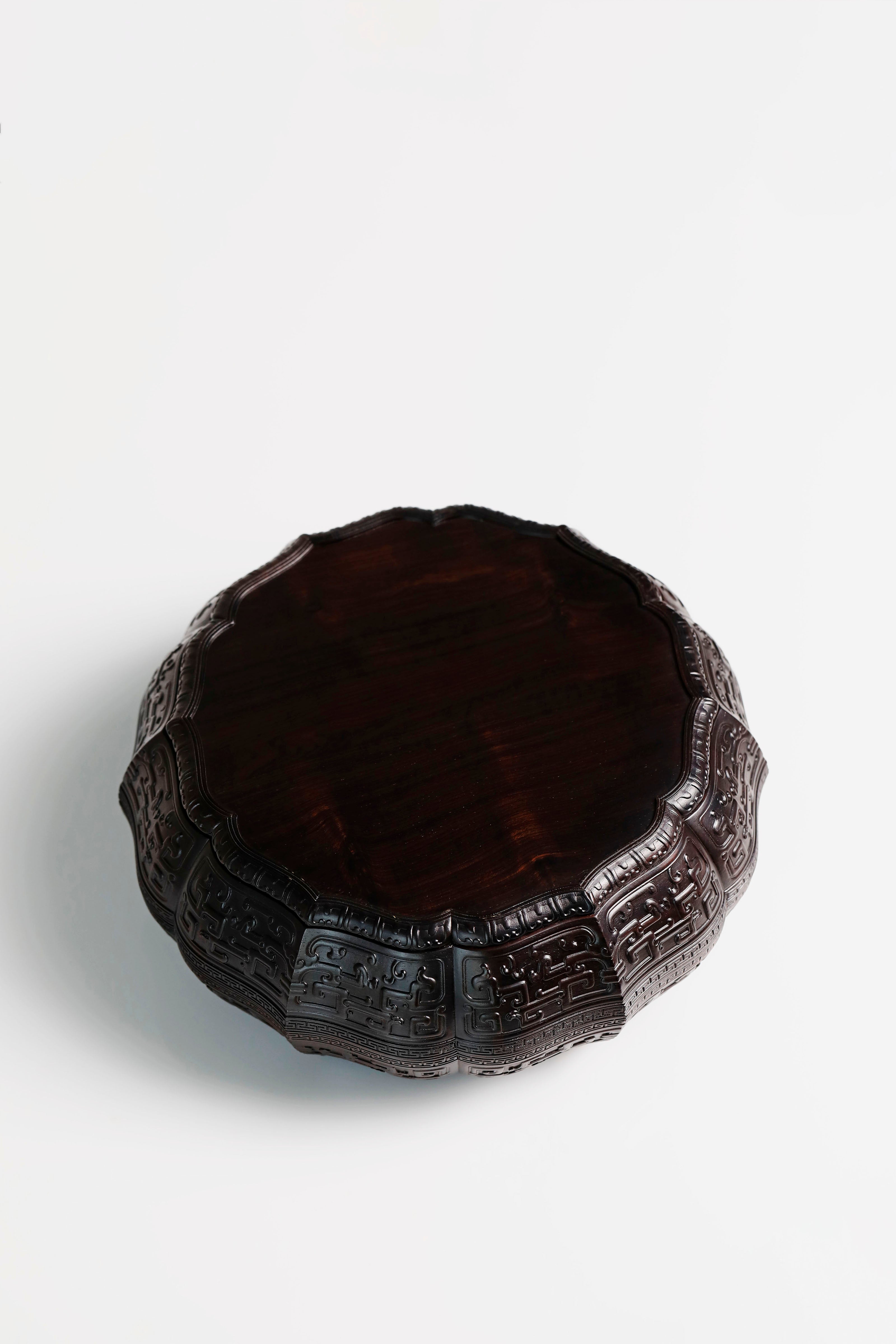 Purple sandalwood twelve-cornered fruit box with gilded Eight Immortals design and sunflower-shaped opening.