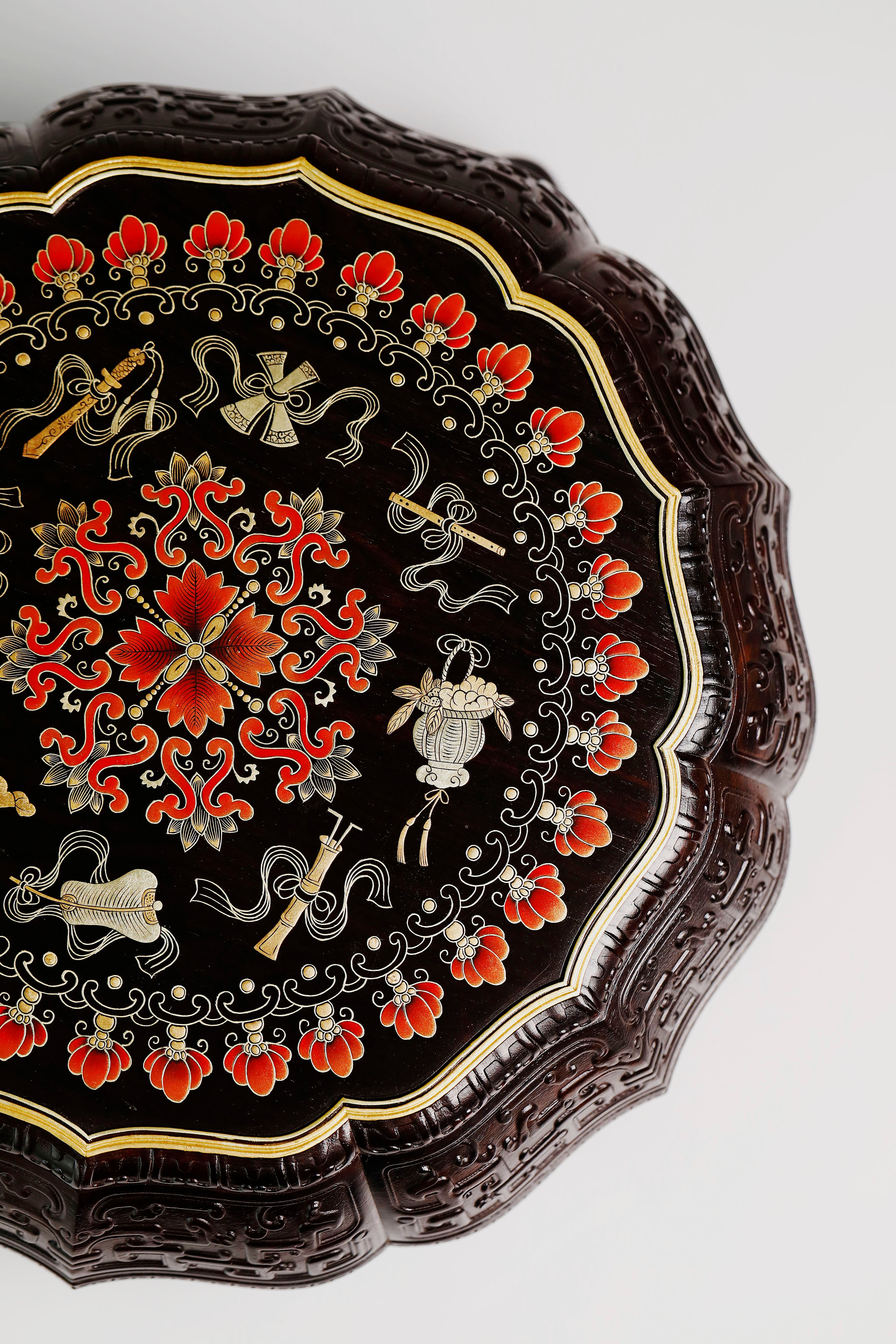 Purple sandalwood twelve-cornered fruit box with gilded Eight Immortals design and sunflower-shaped opening.