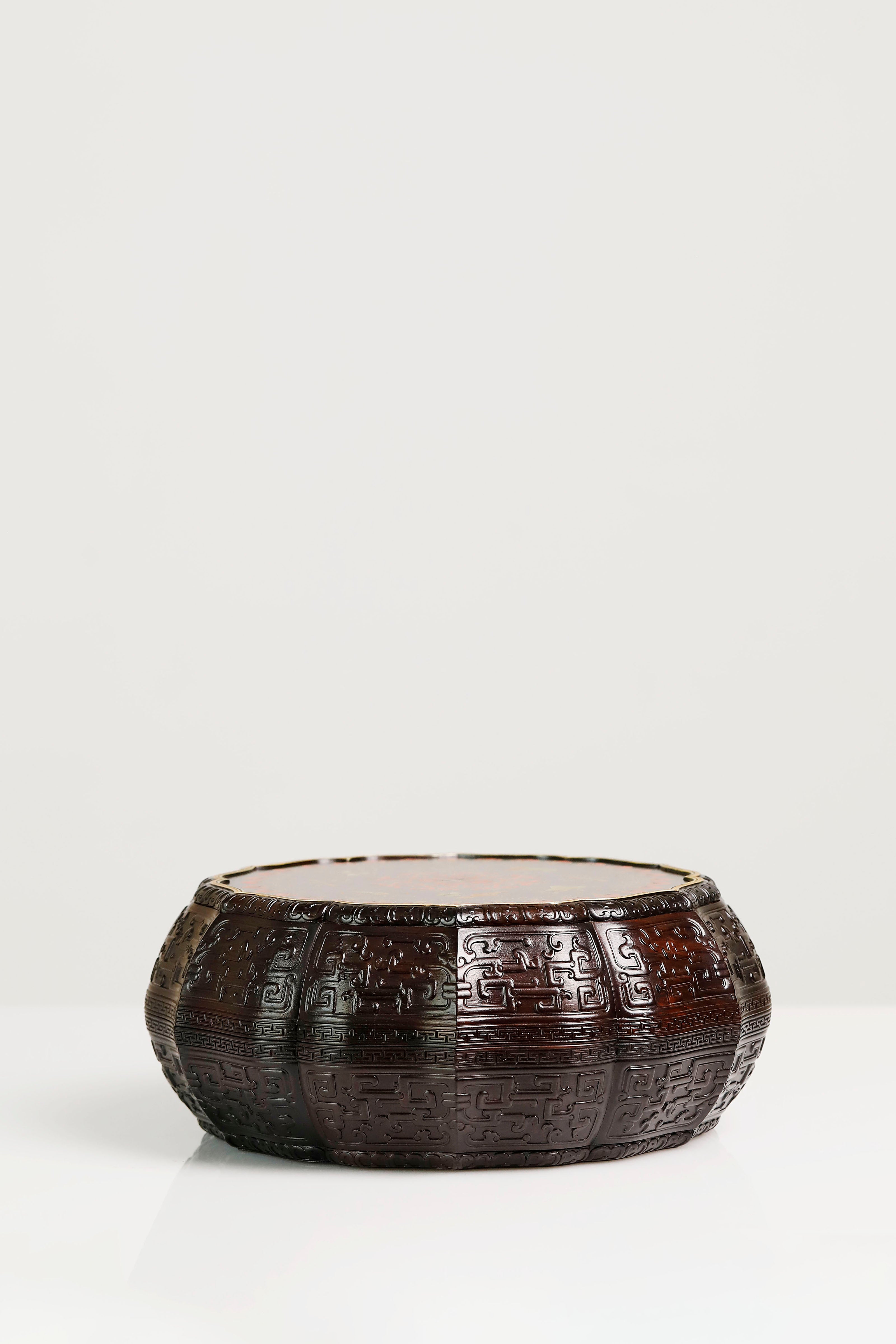 Purple sandalwood twelve-cornered fruit box with gilded Eight Immortals design and sunflower-shaped opening.