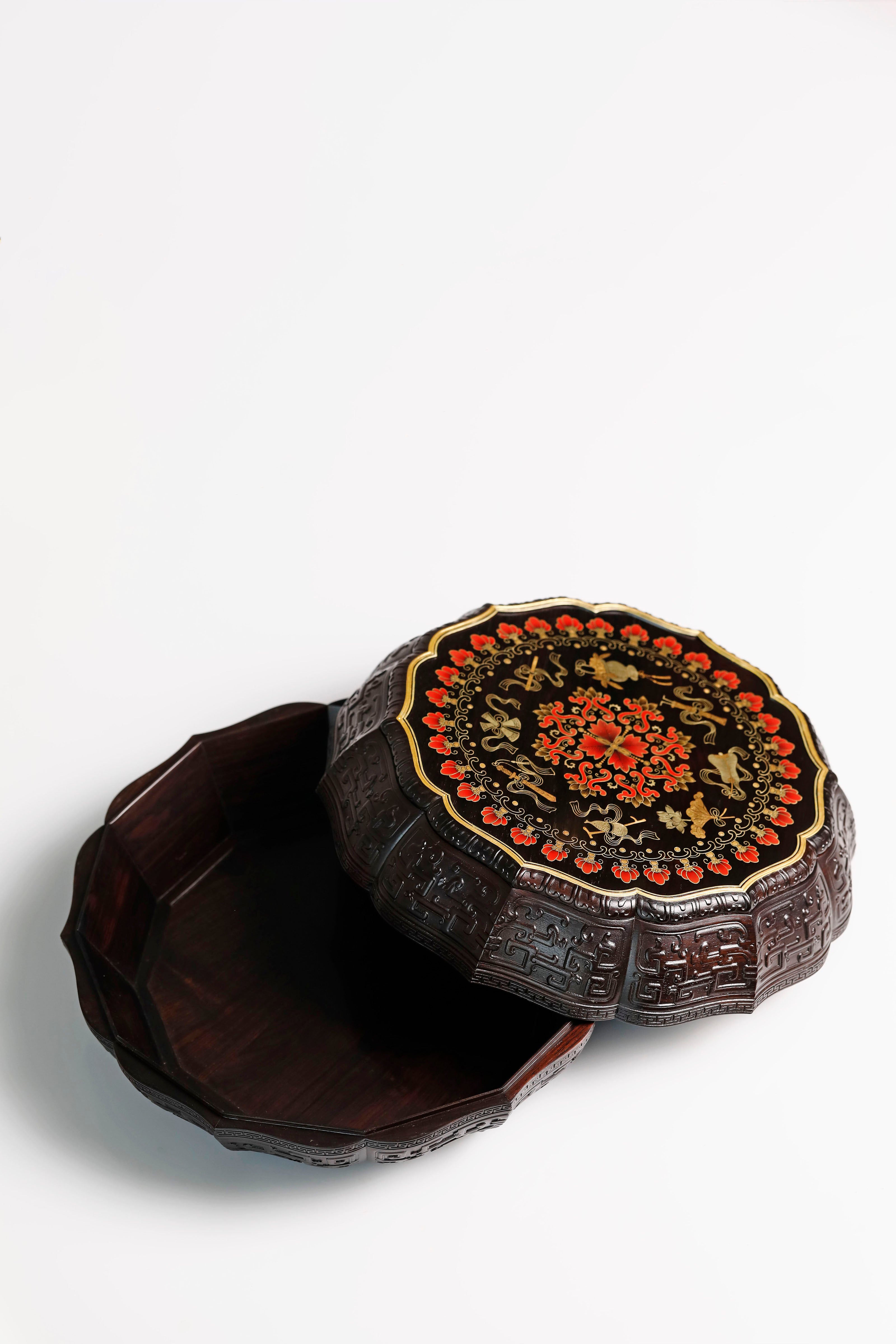 Purple sandalwood twelve-cornered fruit box with gilded Eight Immortals design and sunflower-shaped opening.