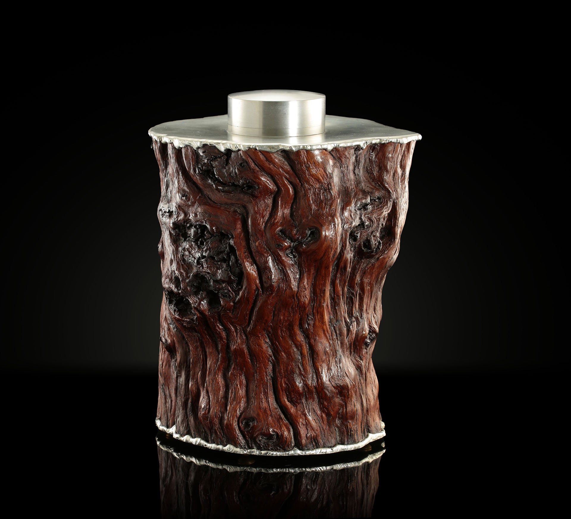 Curved and rugged tin-carved burl wood tea canister