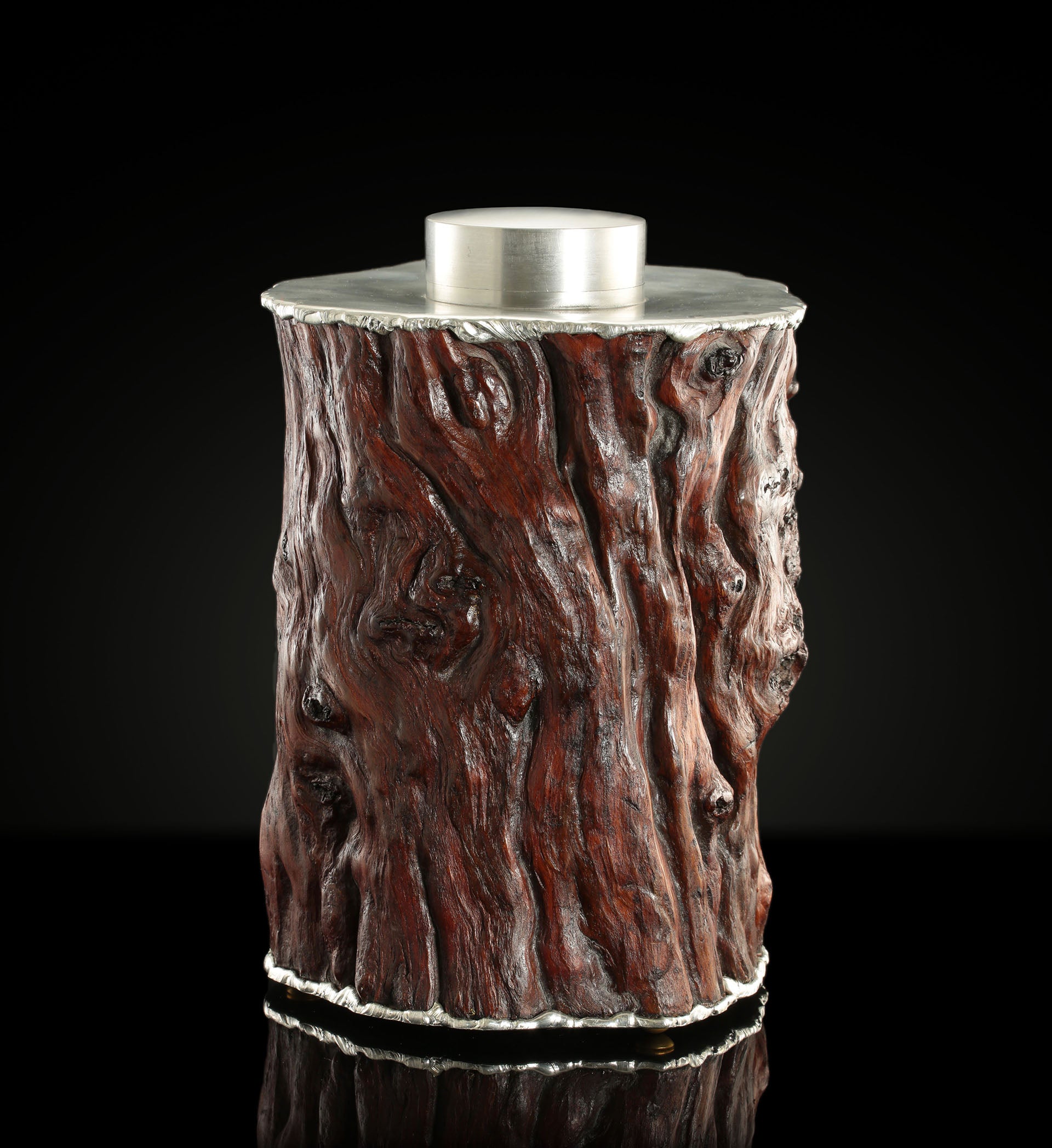 Curved and rugged tin-carved burl wood tea canister
