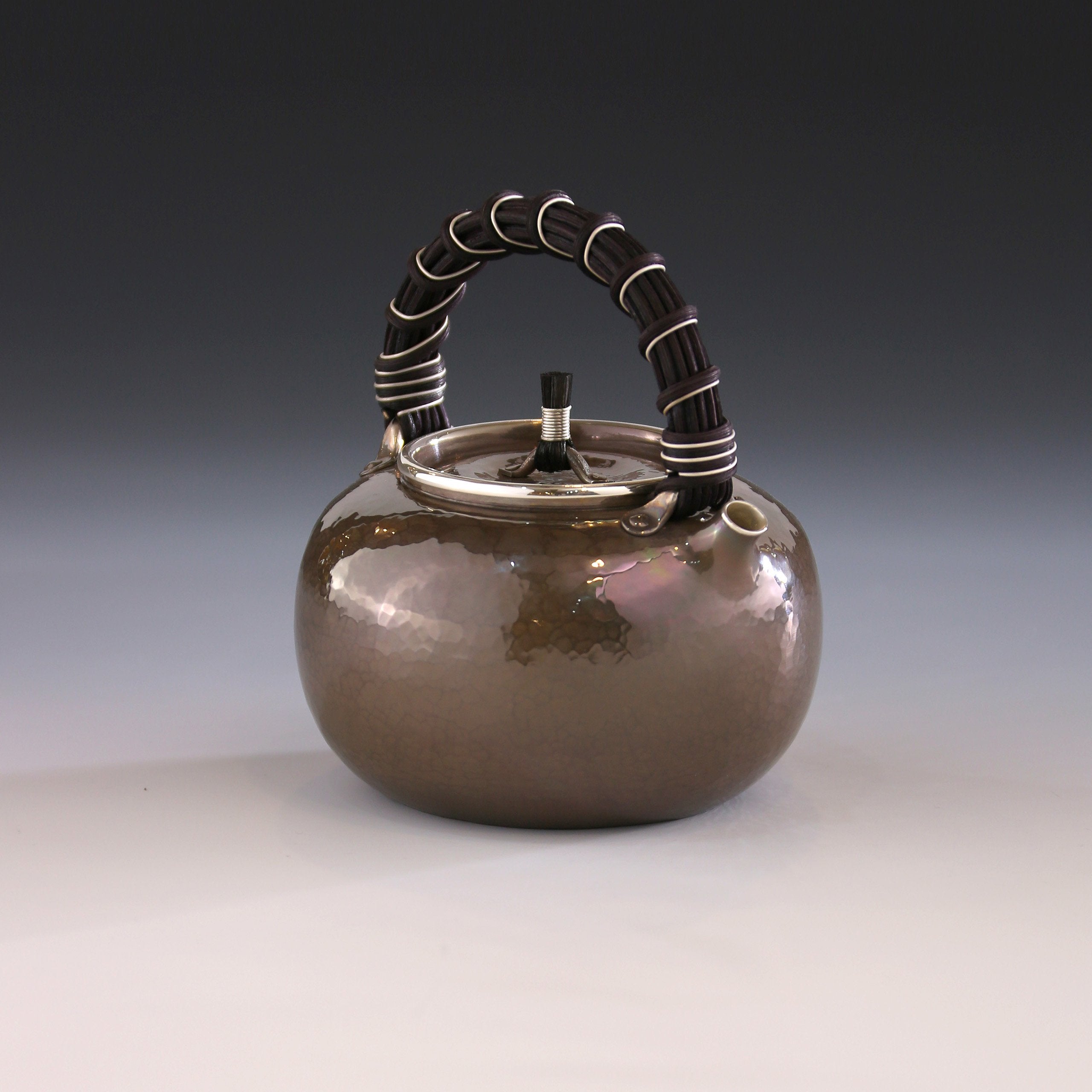 Apple-shaped vine-handled silver teapot