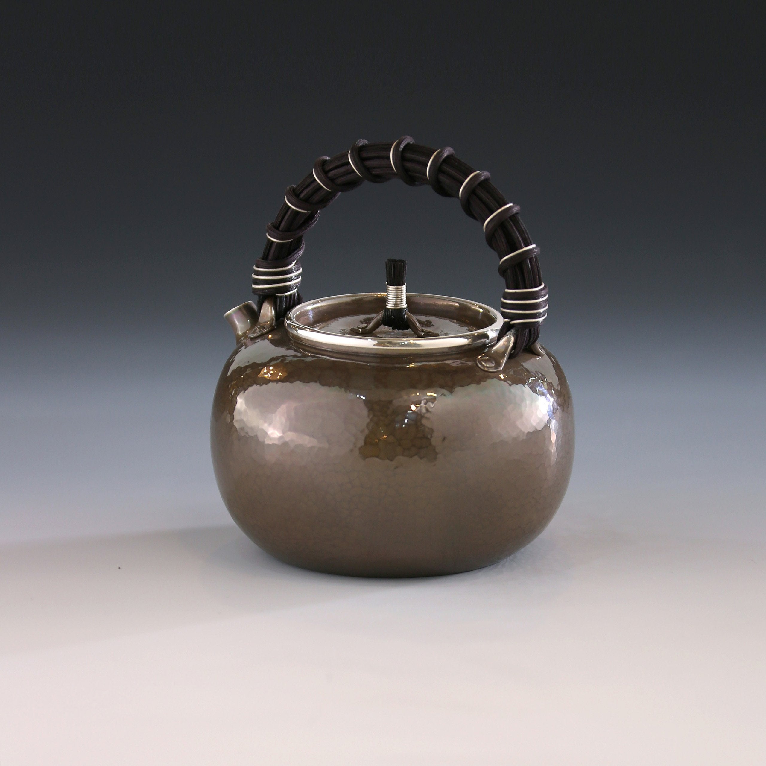 Apple-shaped vine-handled silver teapot