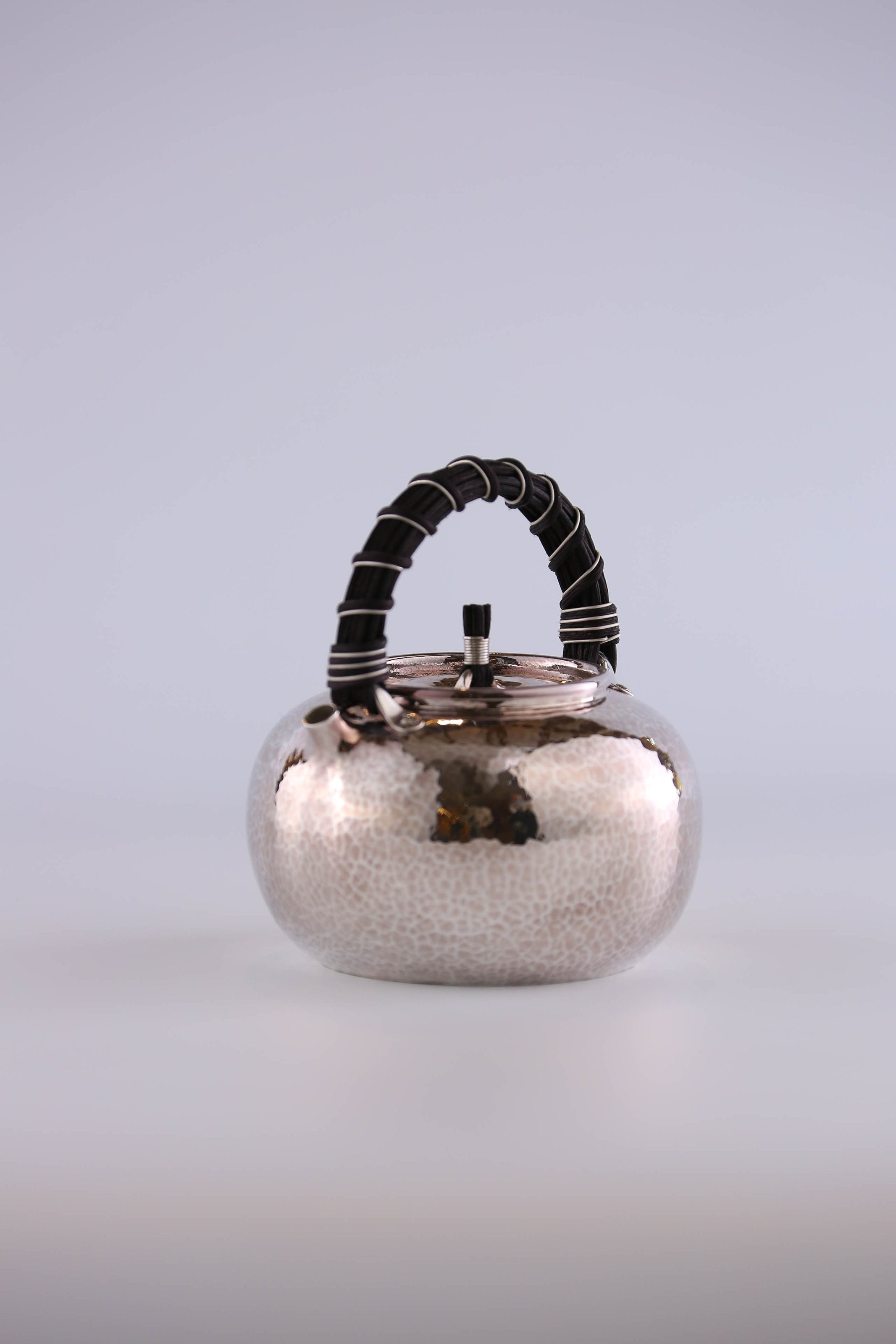 Apple-shaped vine-handled silver teapot