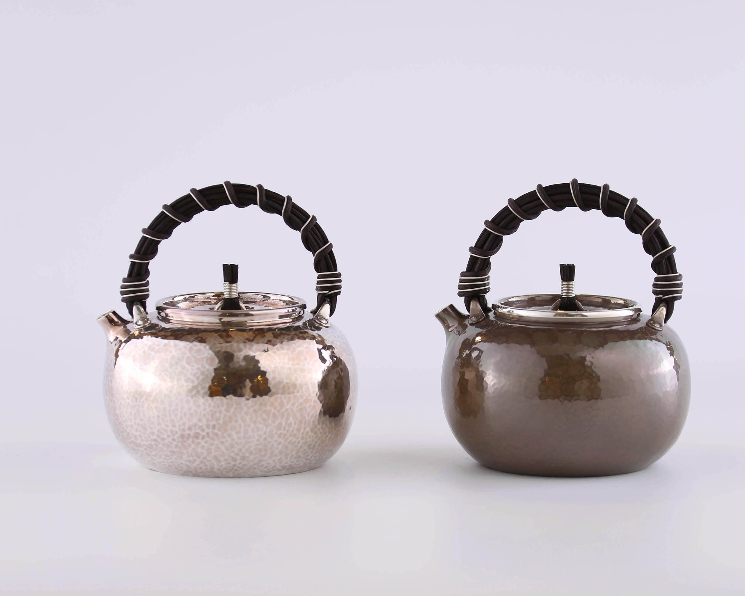 Apple-shaped vine-handled silver teapot