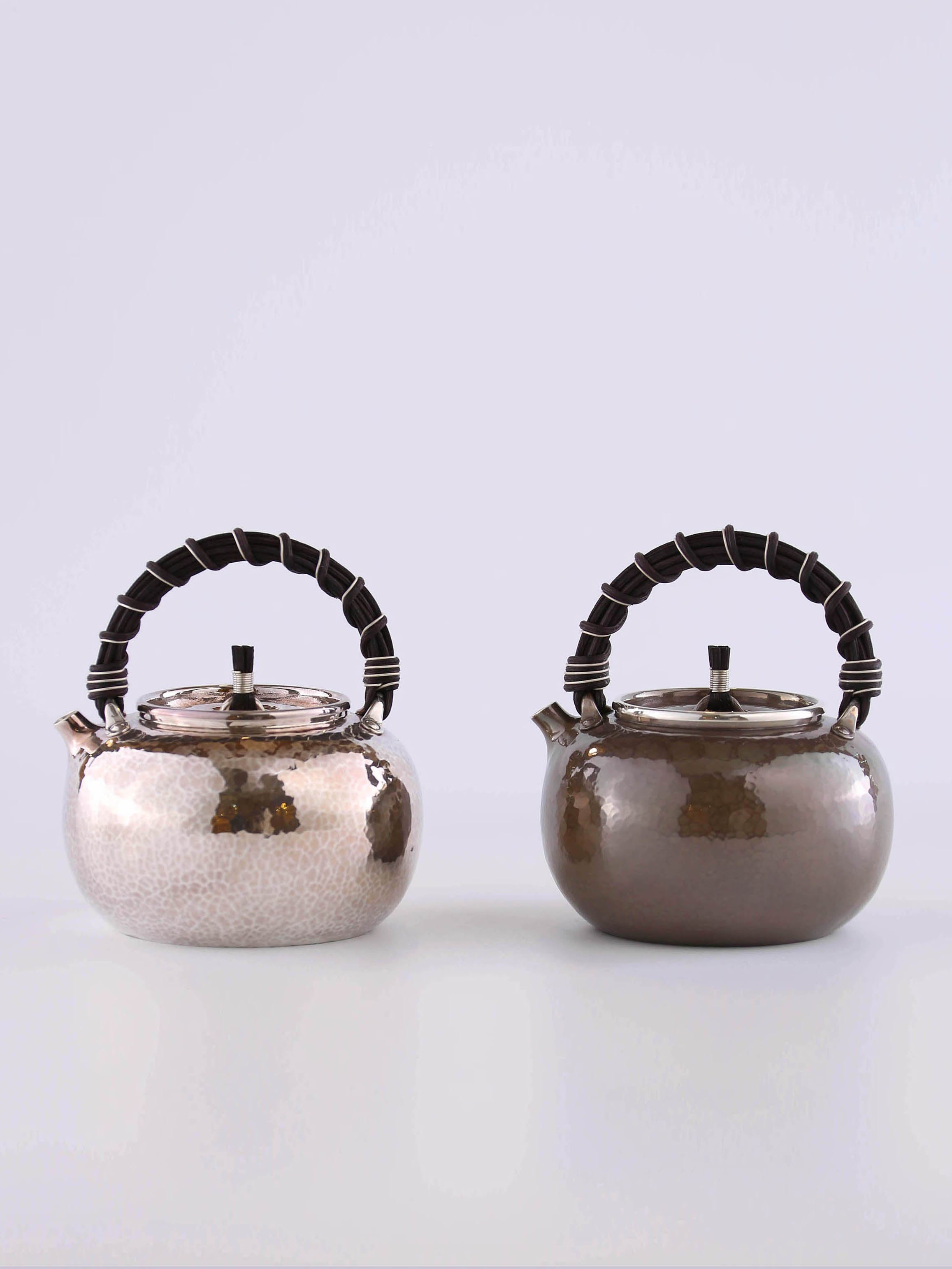 Apple-shaped vine-handled silver teapot