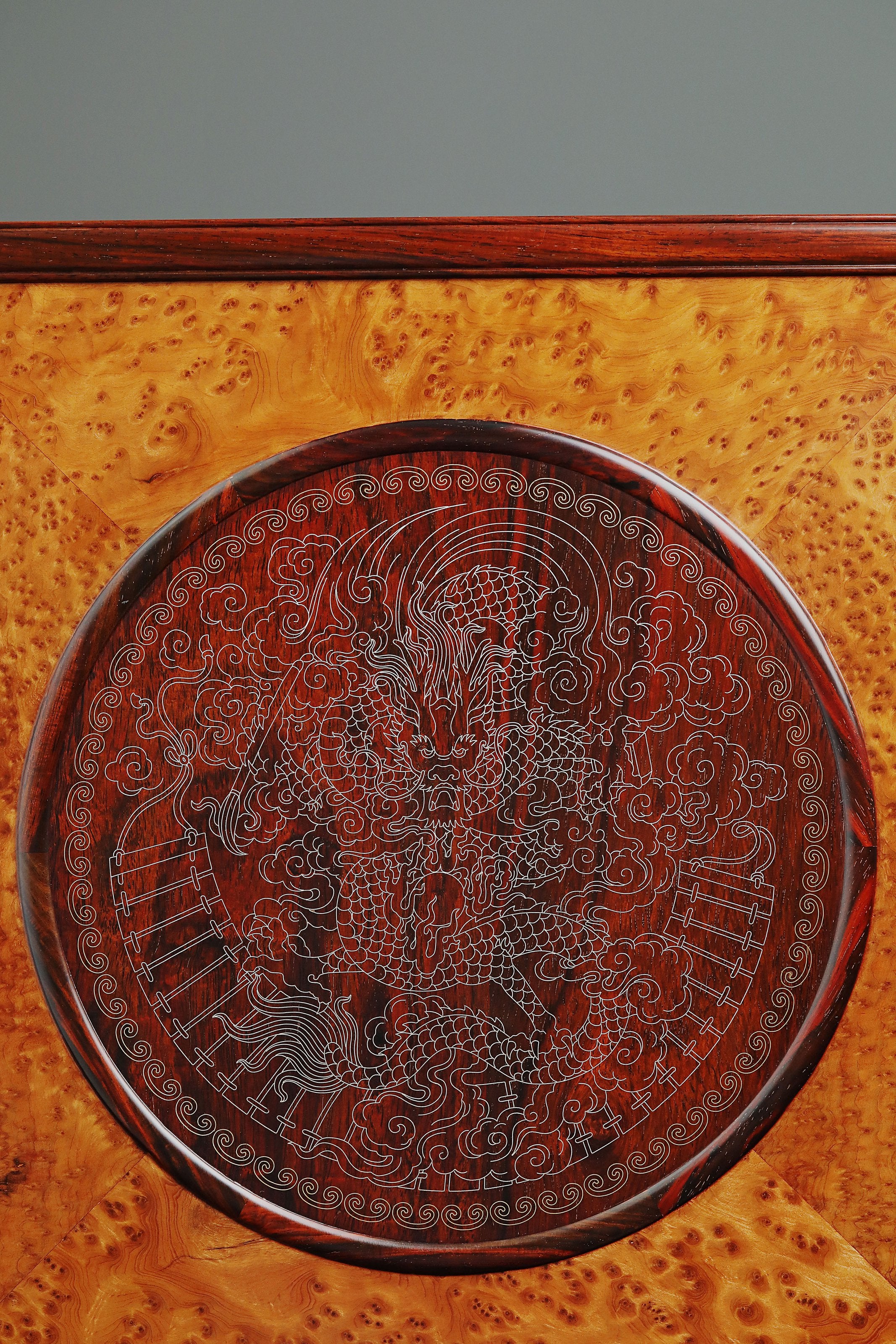 Rosewood screen inlaid with silver dragon design