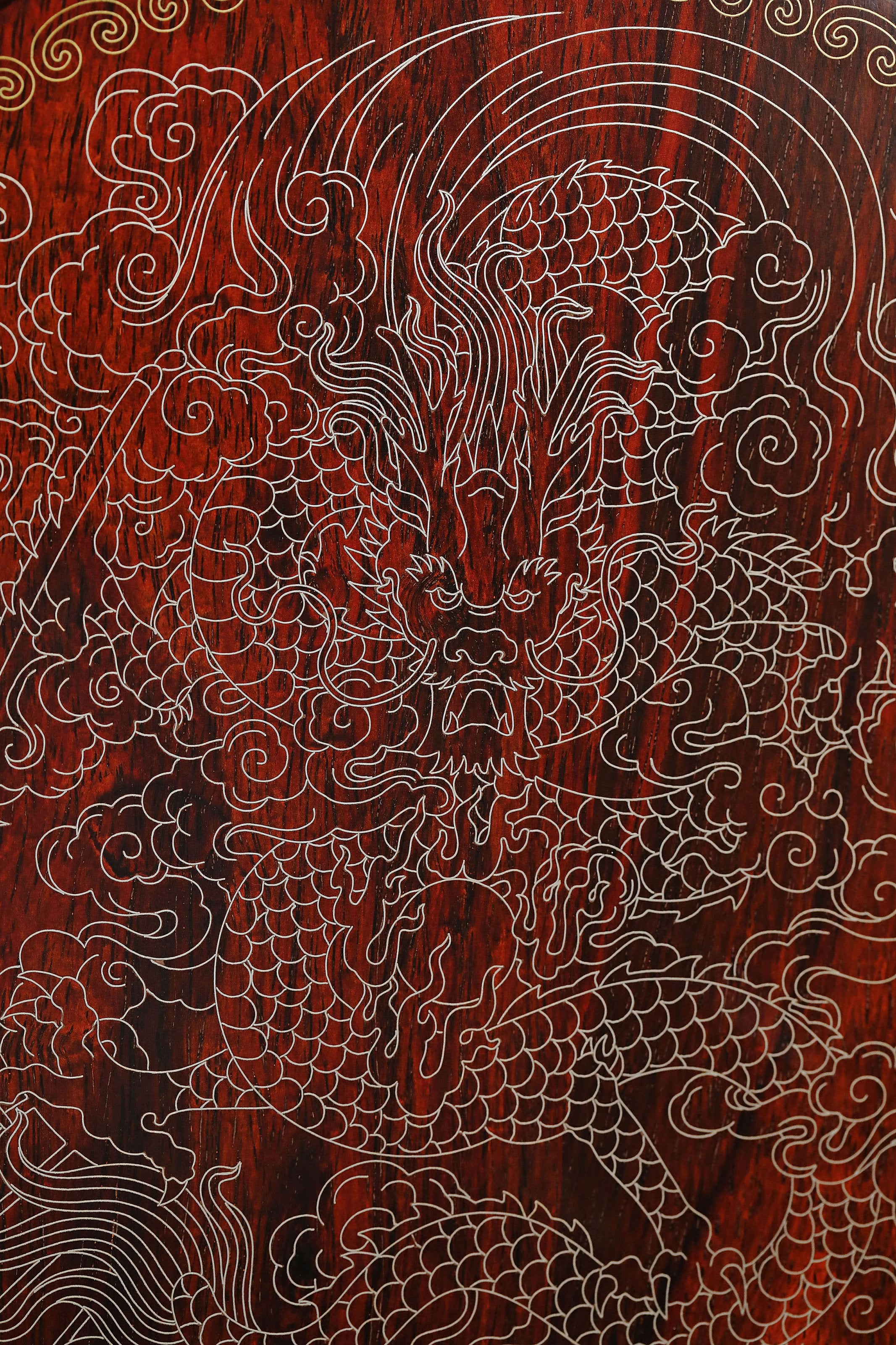 Rosewood screen inlaid with silver dragon design