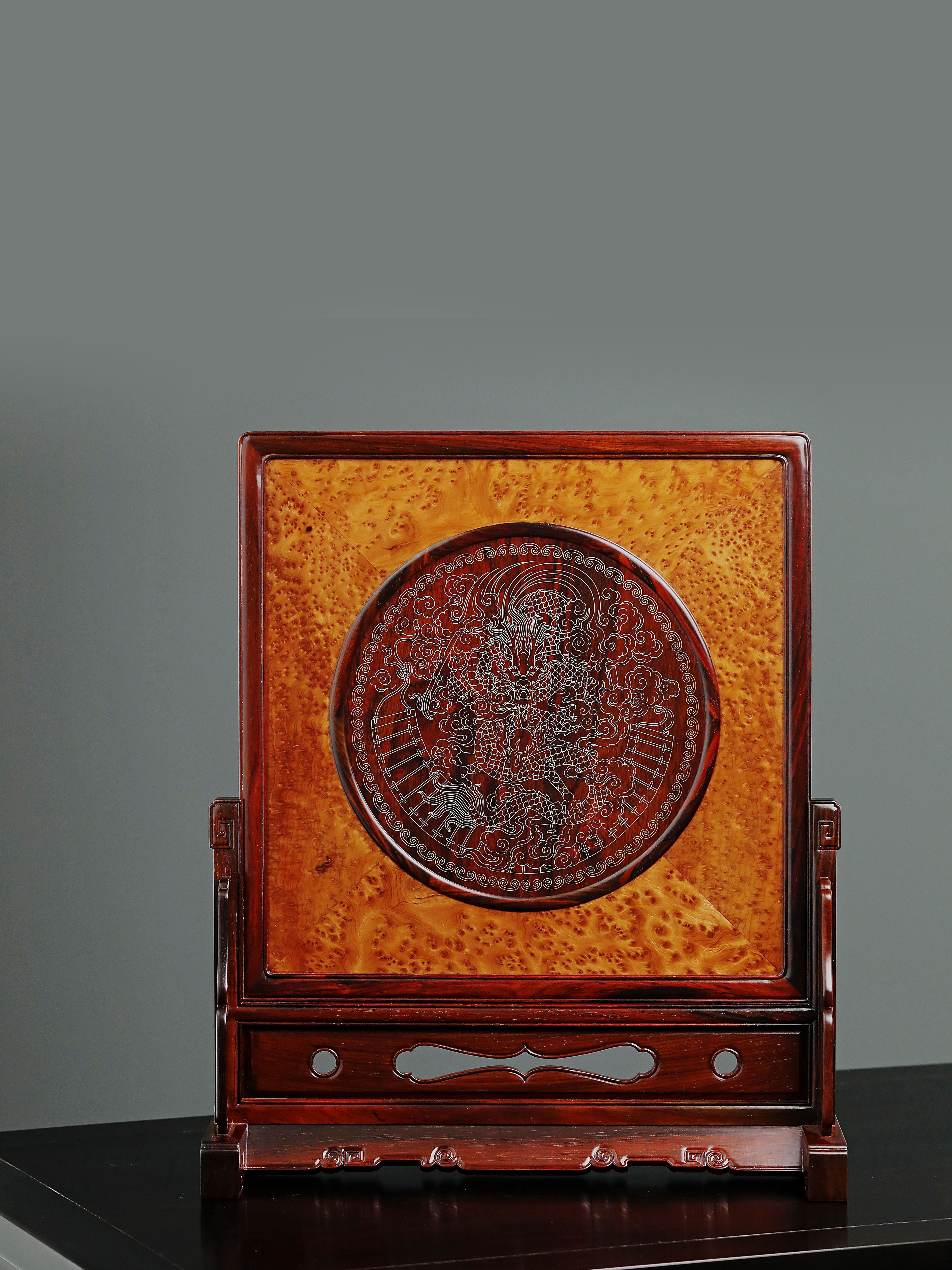 Rosewood screen inlaid with silver dragon design