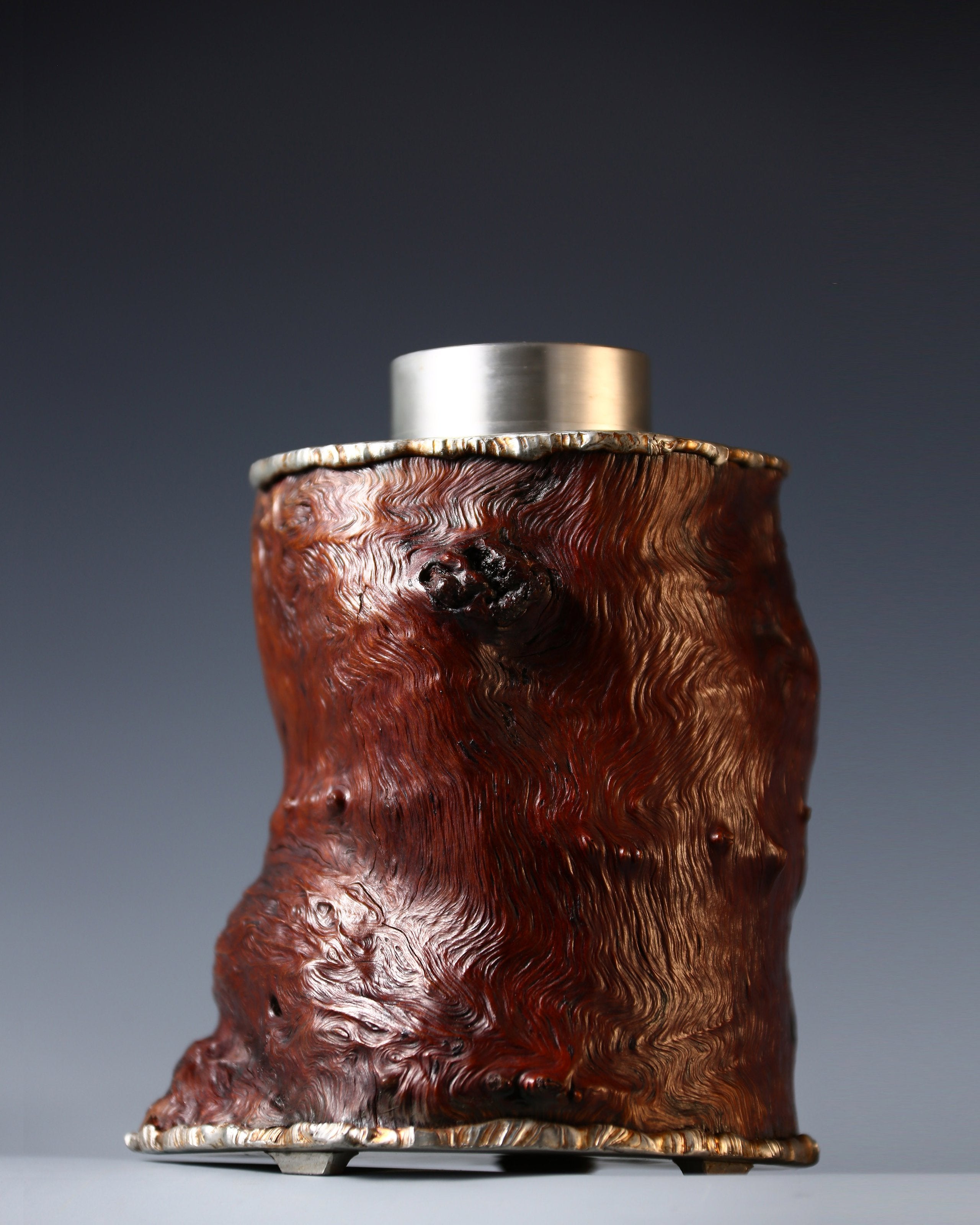 Strong and powerful tin-carved burl wood tea caddy