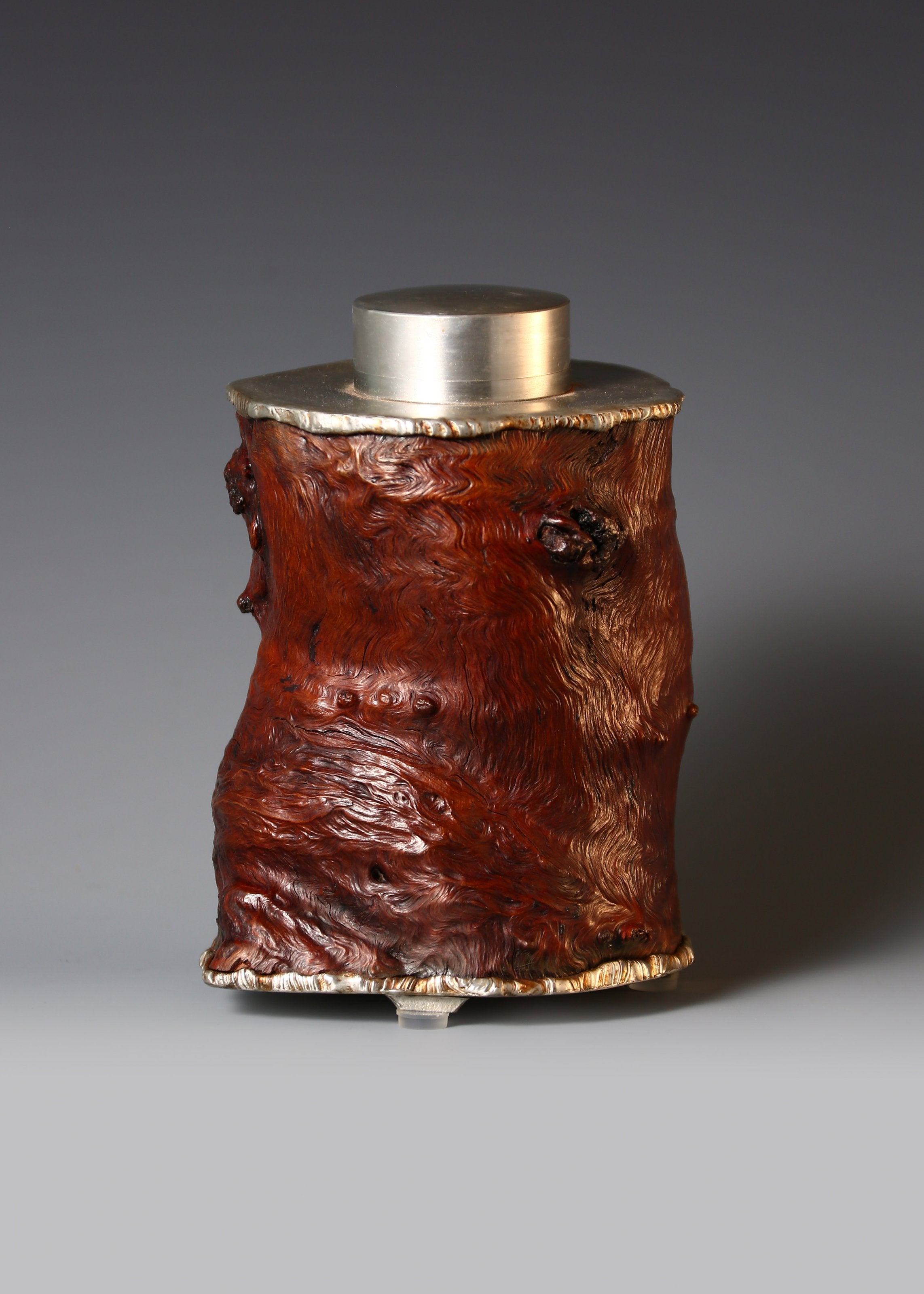Strong and powerful tin-carved burl wood tea caddy