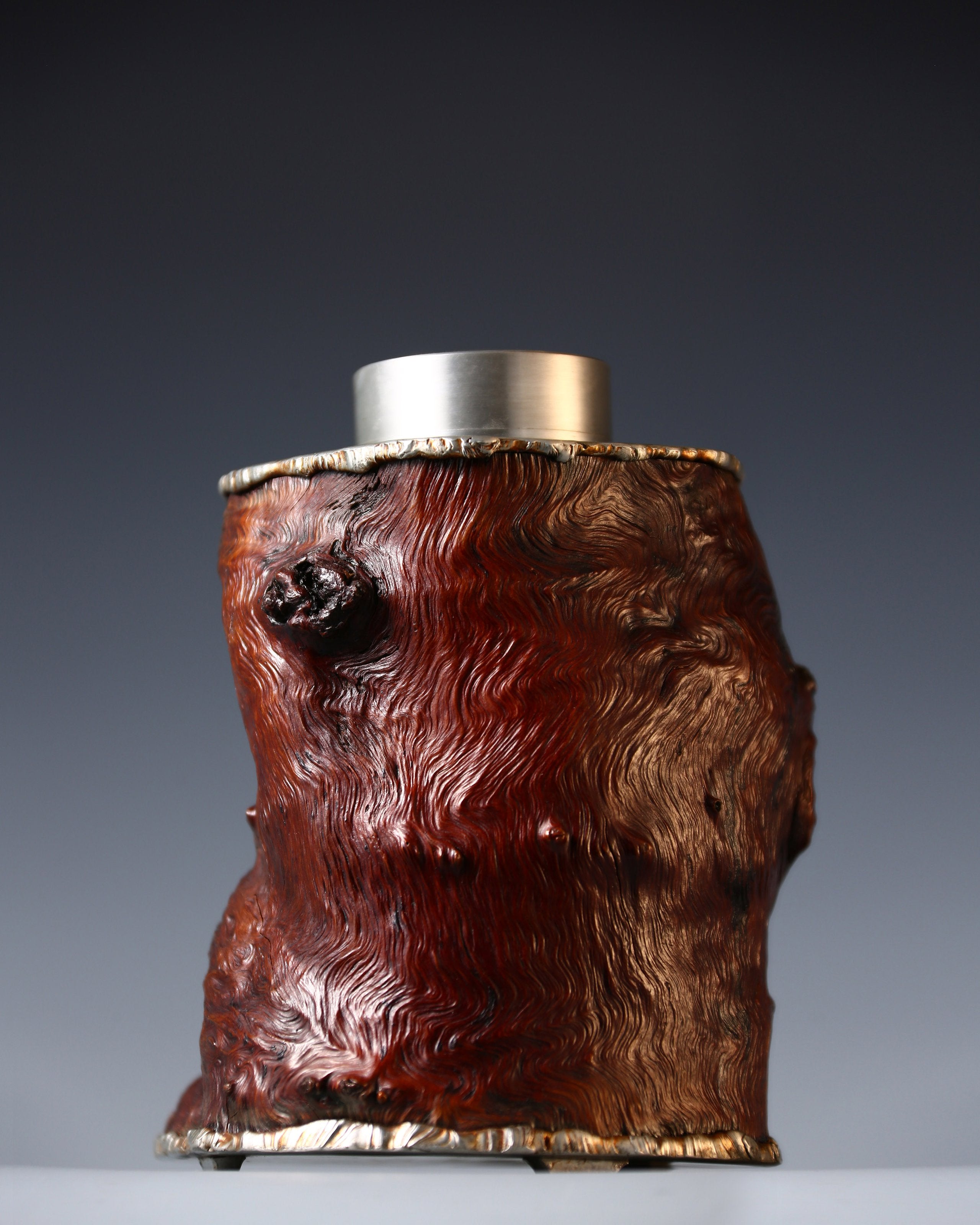 Strong and powerful tin-carved burl wood tea caddy