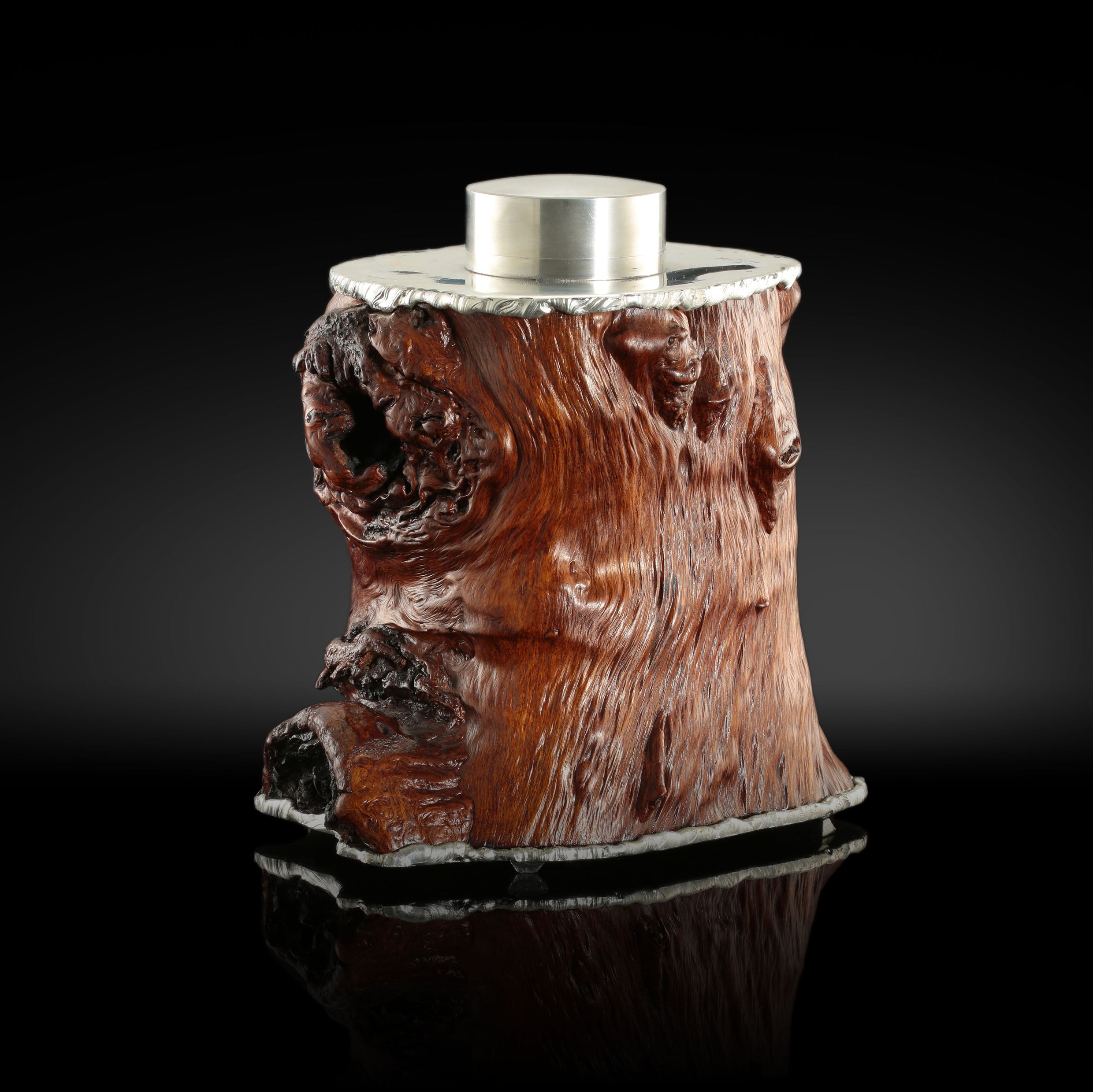 Gnarled branches and tin-carved burl wood tea caddy