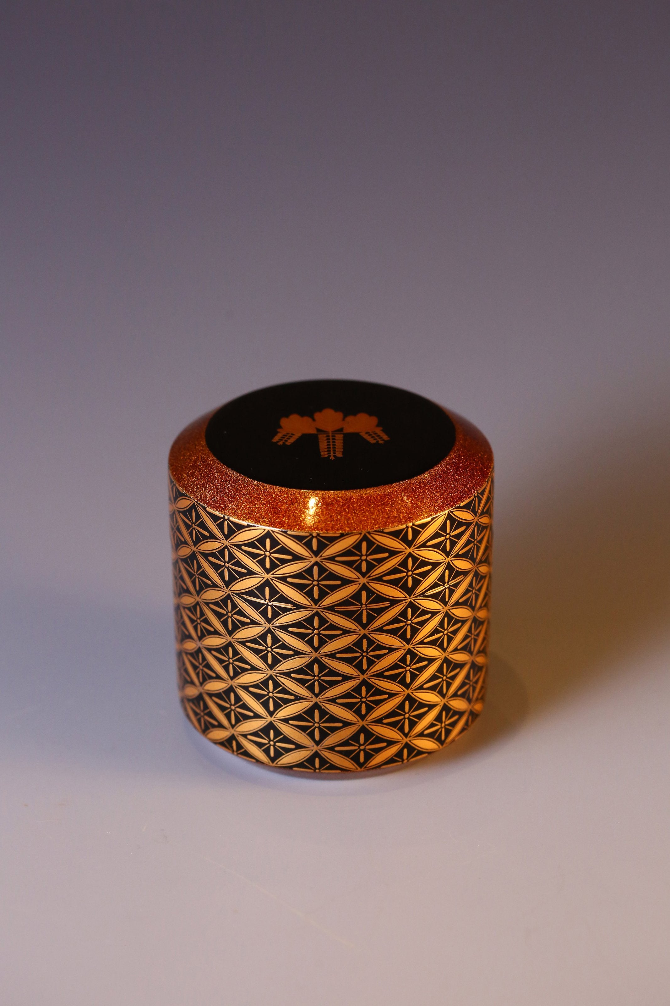 Japanese gold maki-e (a type of embroidery) with seven treasures and snow-blown dates.