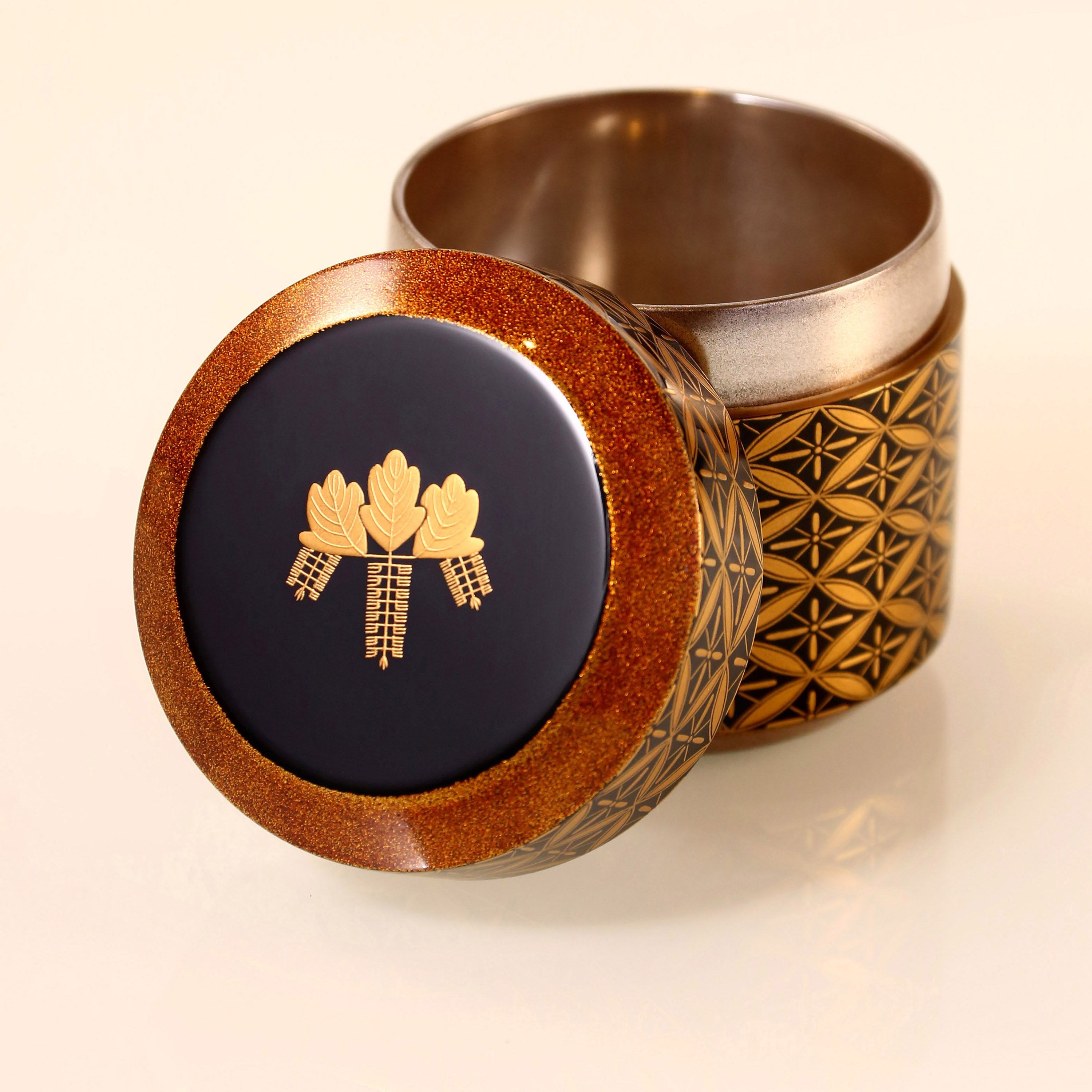 Japanese gold maki-e (a type of embroidery) with seven treasures and snow-blown dates.