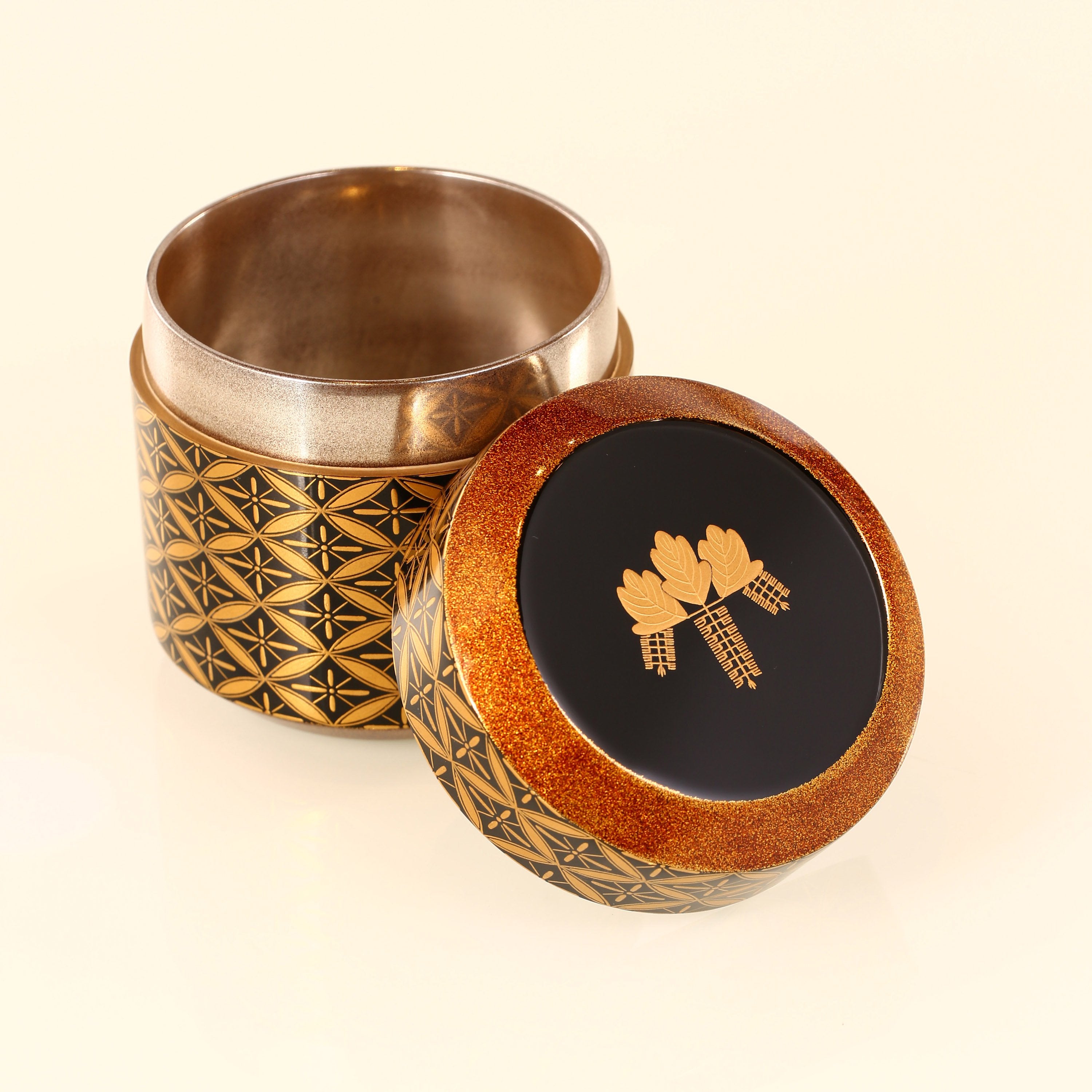 Japanese gold maki-e (a type of embroidery) with seven treasures and snow-blown dates.