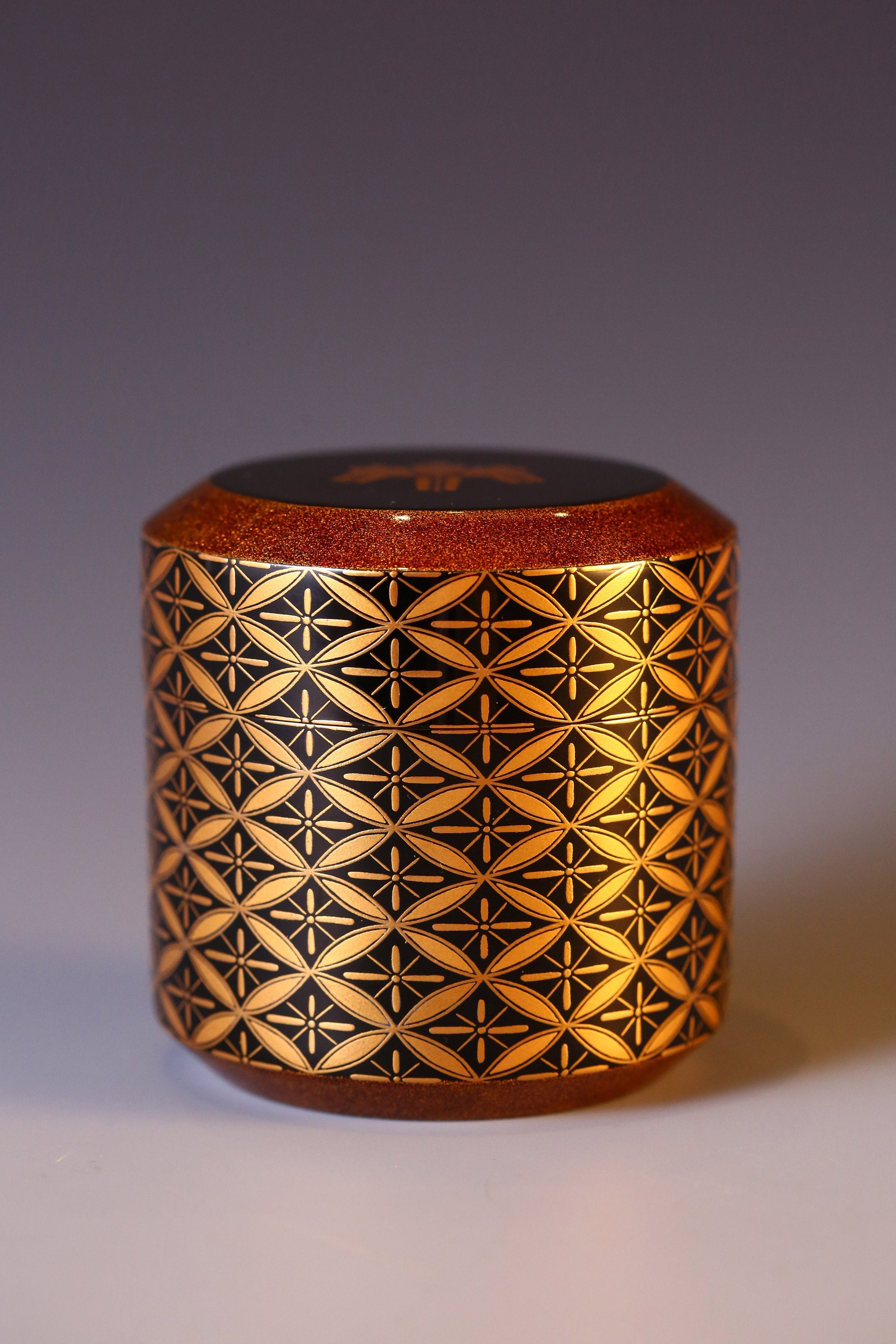 Japanese gold maki-e (a type of embroidery) with seven treasures and snow-blown dates.