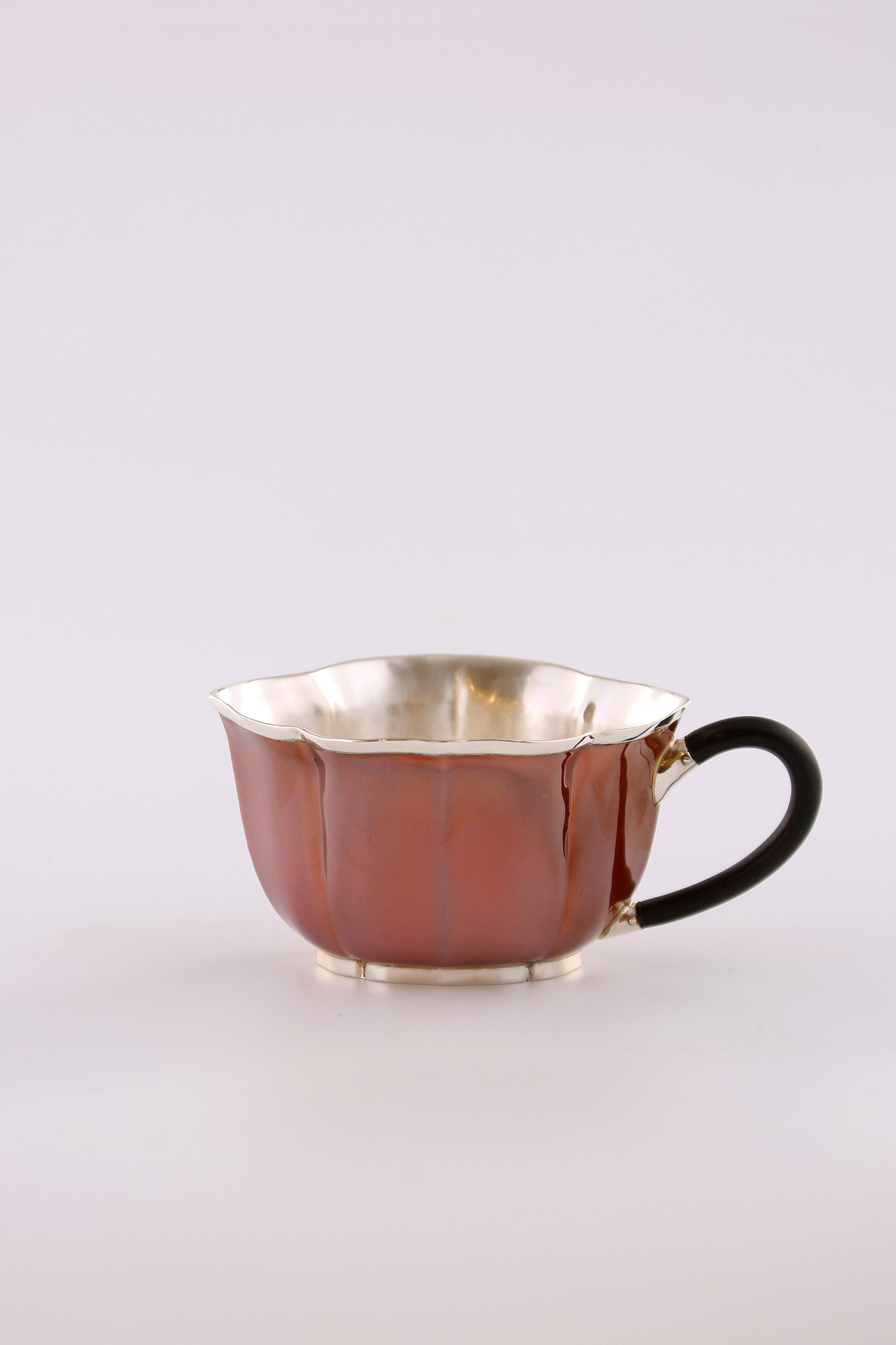 A set of Ruyi petal-shaped copper-plated silver teapot and serving cup