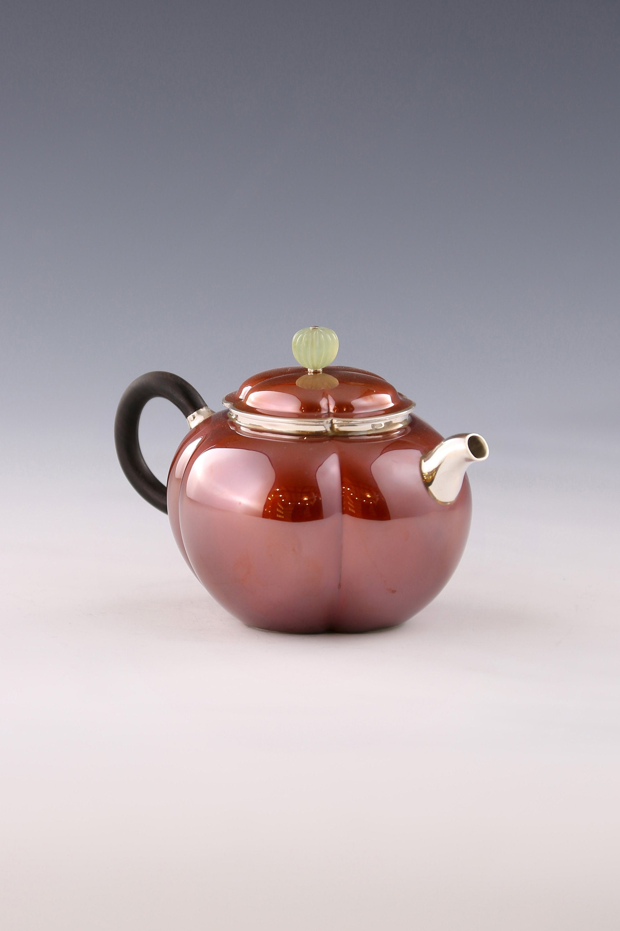 A set of Ruyi petal-shaped copper-plated silver teapot and serving cup