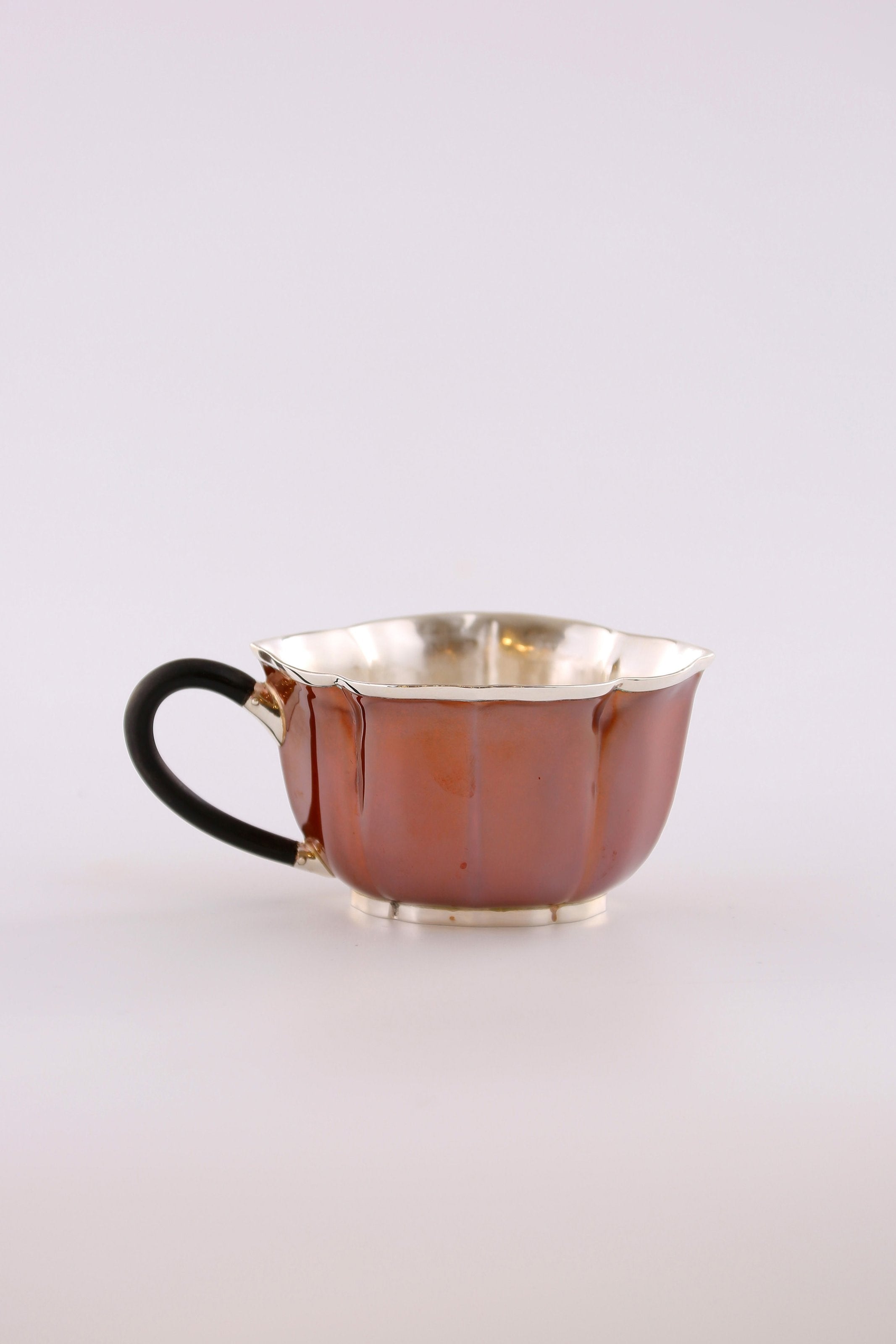 A set of Ruyi petal-shaped copper-plated silver teapot and serving cup