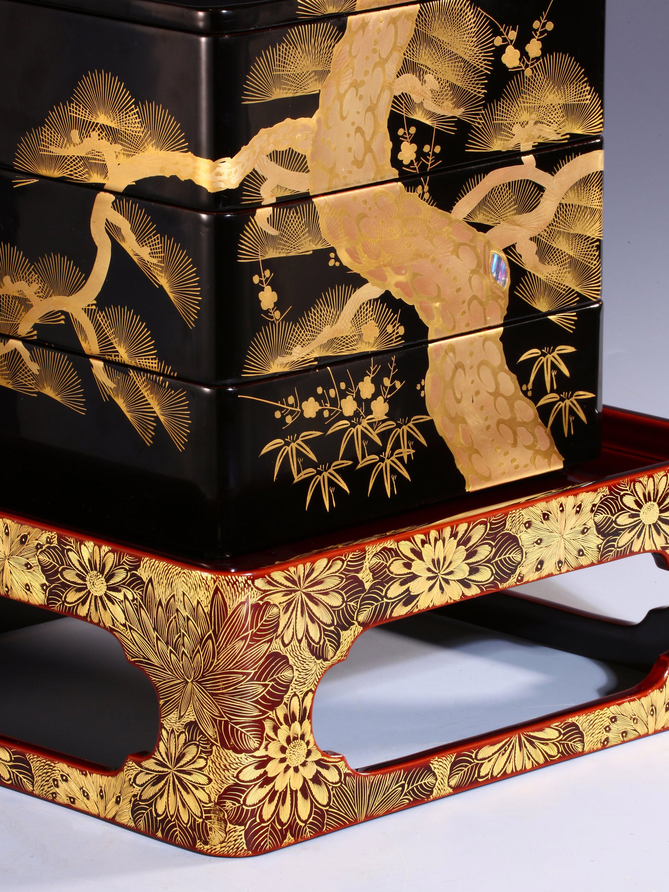 Japanese Meiji period tea box with pine, bamboo, and plum design, tea stall with chrysanthemum pattern.