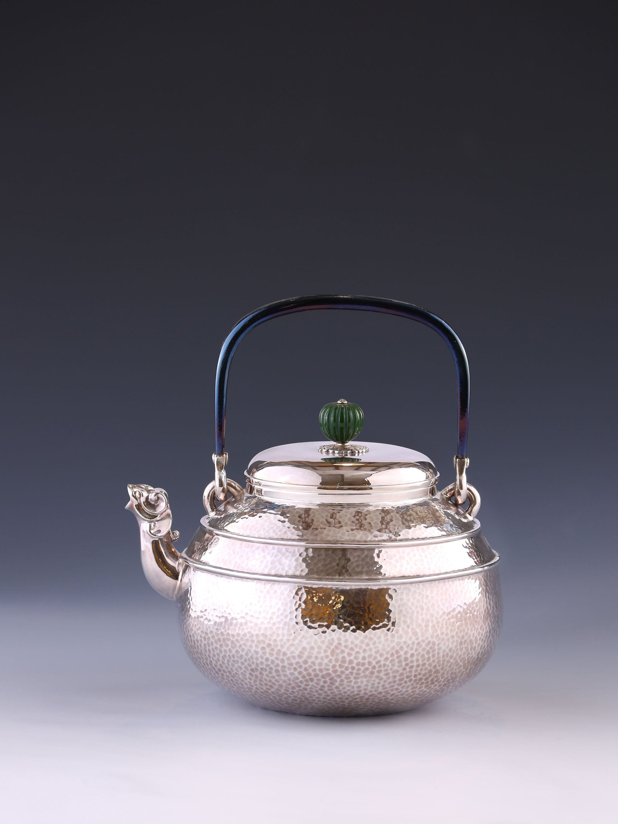 Silver ewer with animal-shaped mouth and double waistline