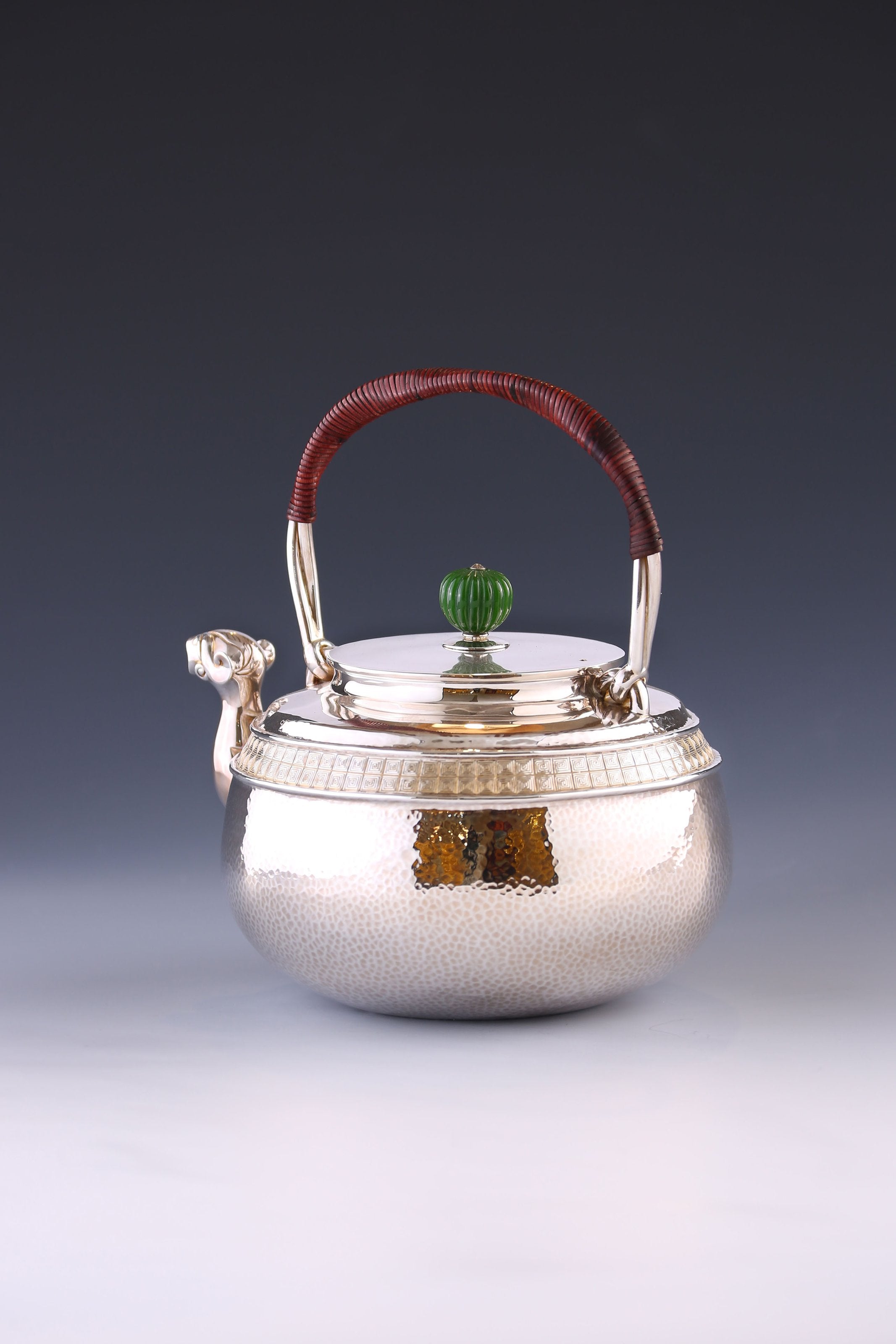 Silver ewer with animal-shaped mouth and double waistline fretwork