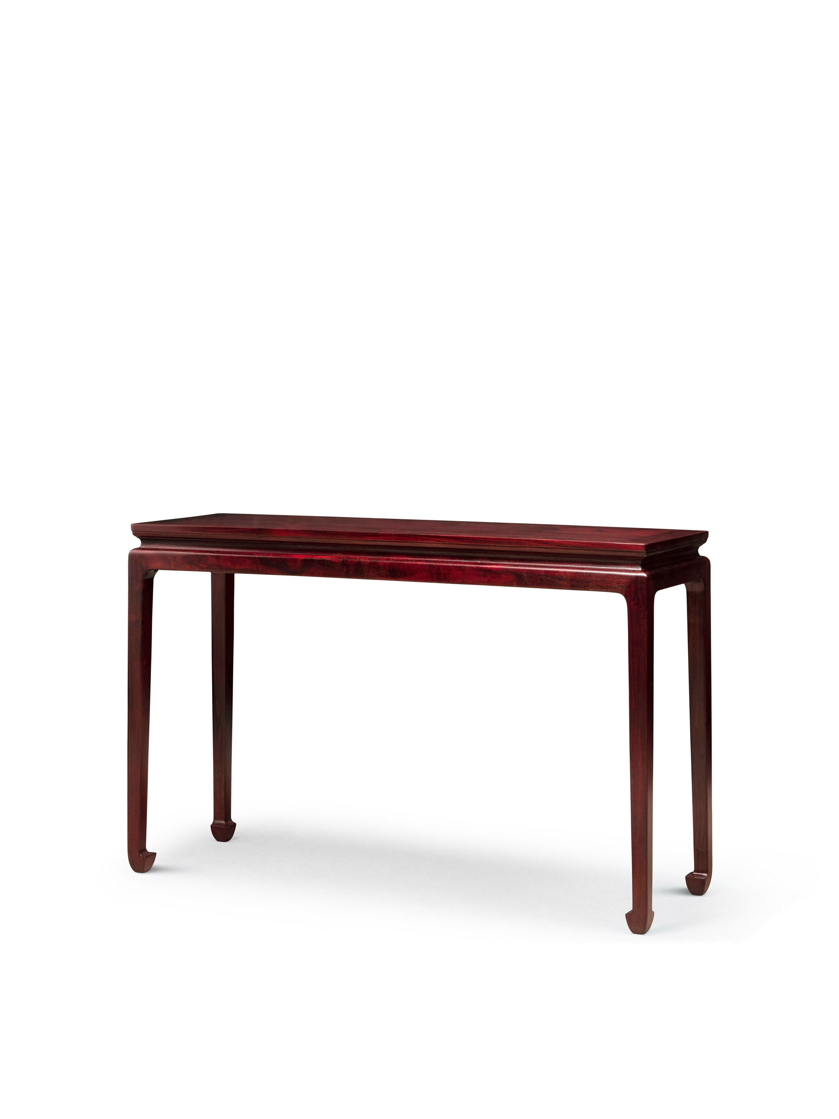 Long table with waisted legs and hoof feet