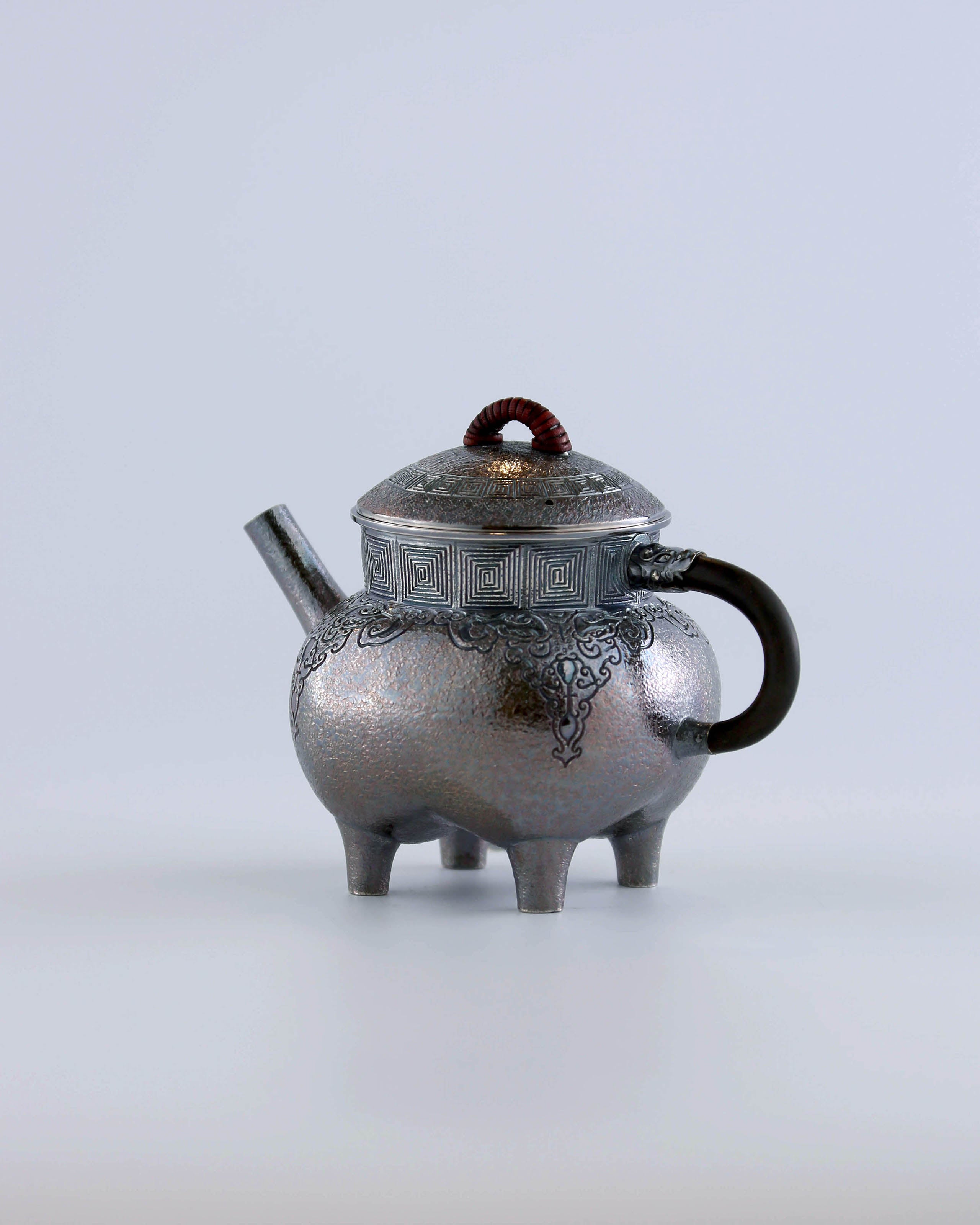 Four-legged silver ewer with dragon design