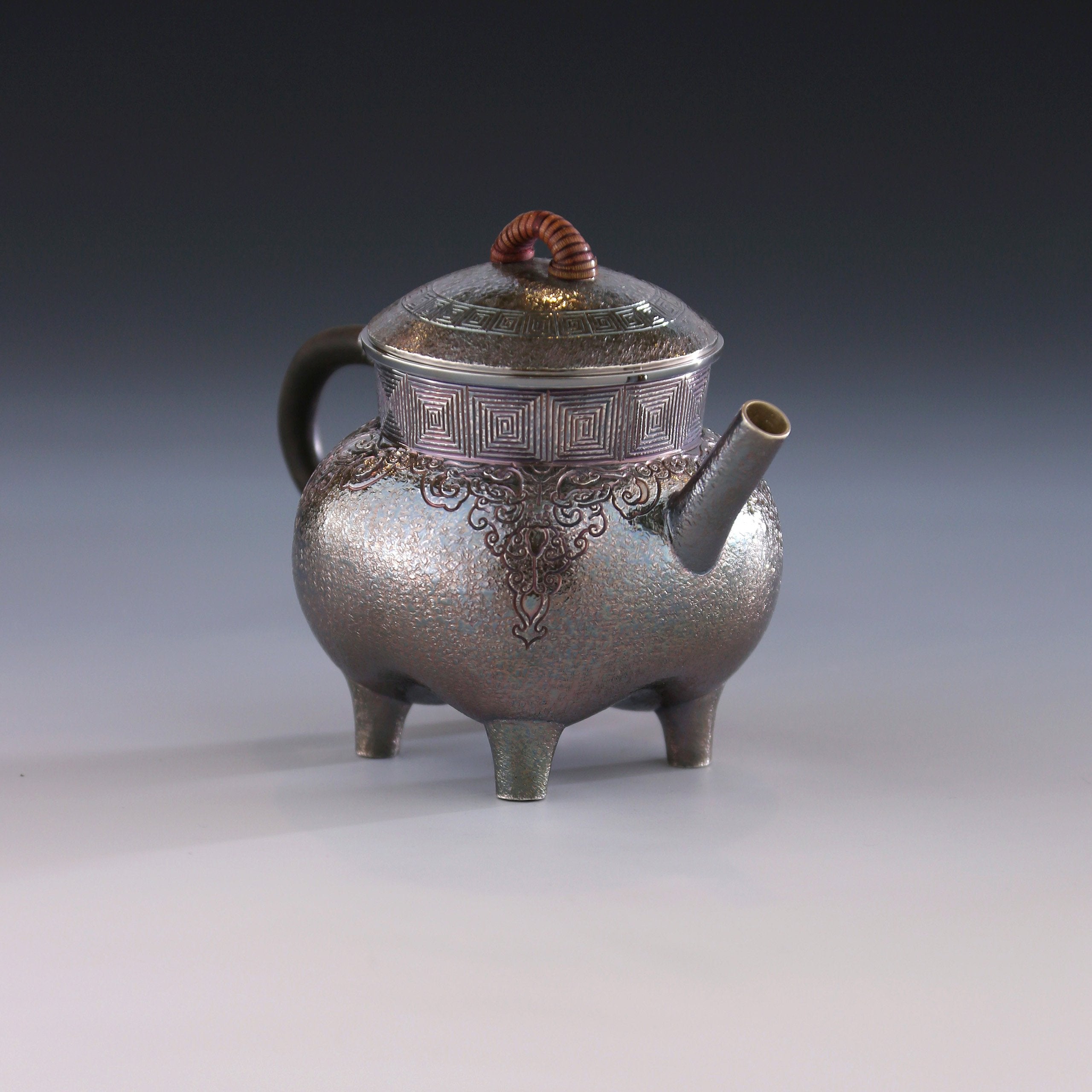 Four-legged silver ewer with dragon design