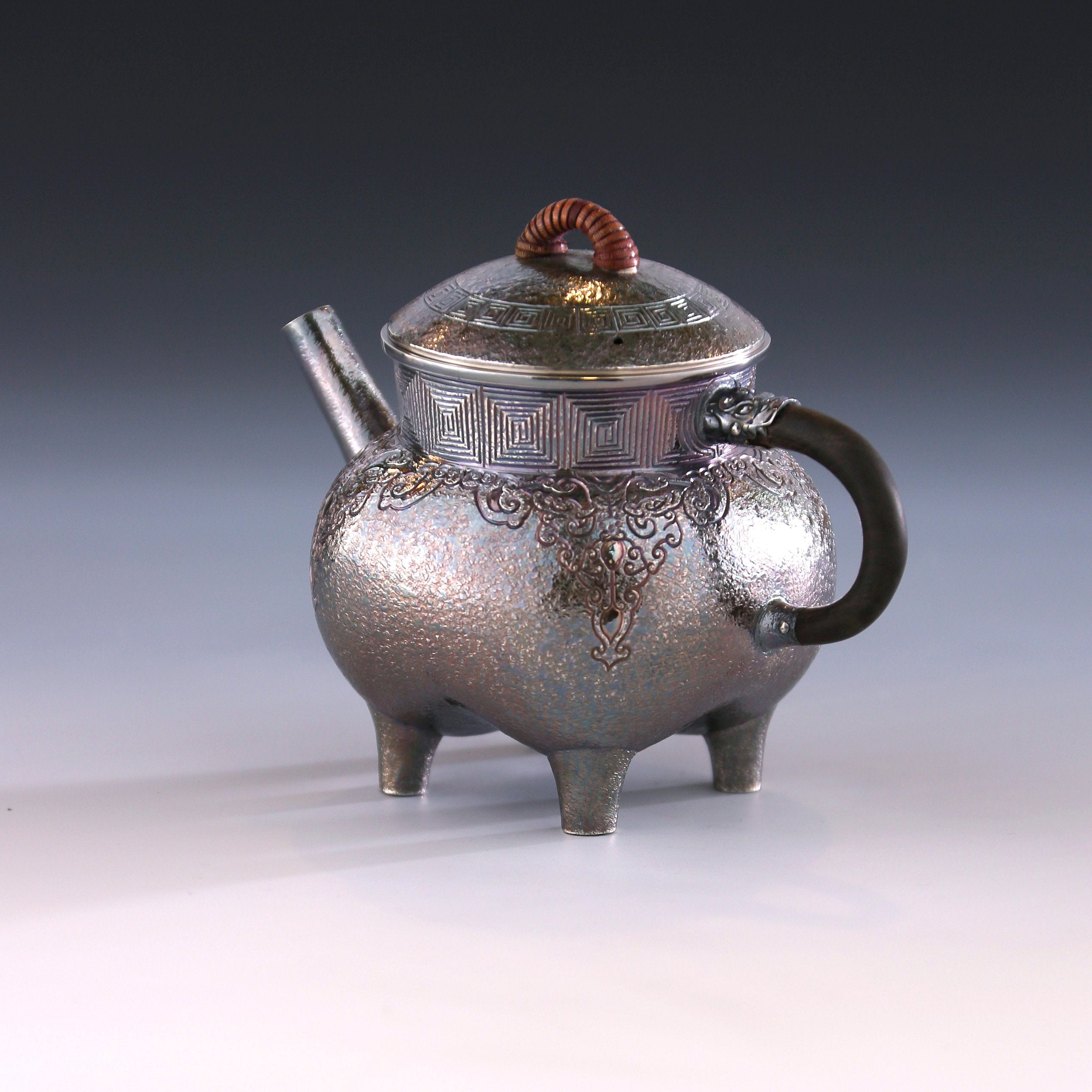 Four-legged silver ewer with dragon design