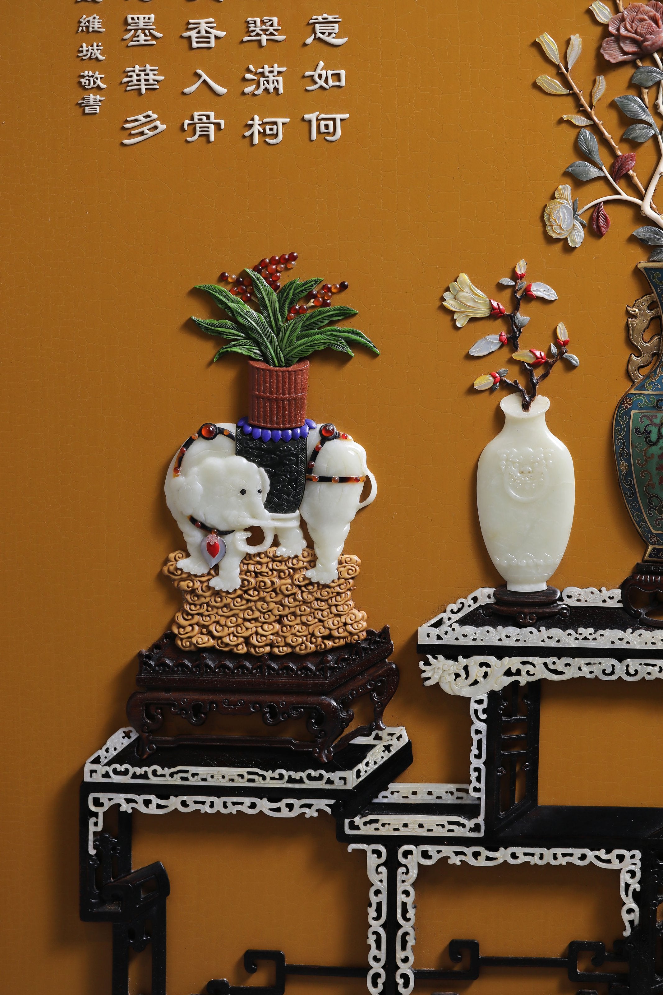 A hanging screen inlaid with precious stones, symbolizing peace and prosperity.