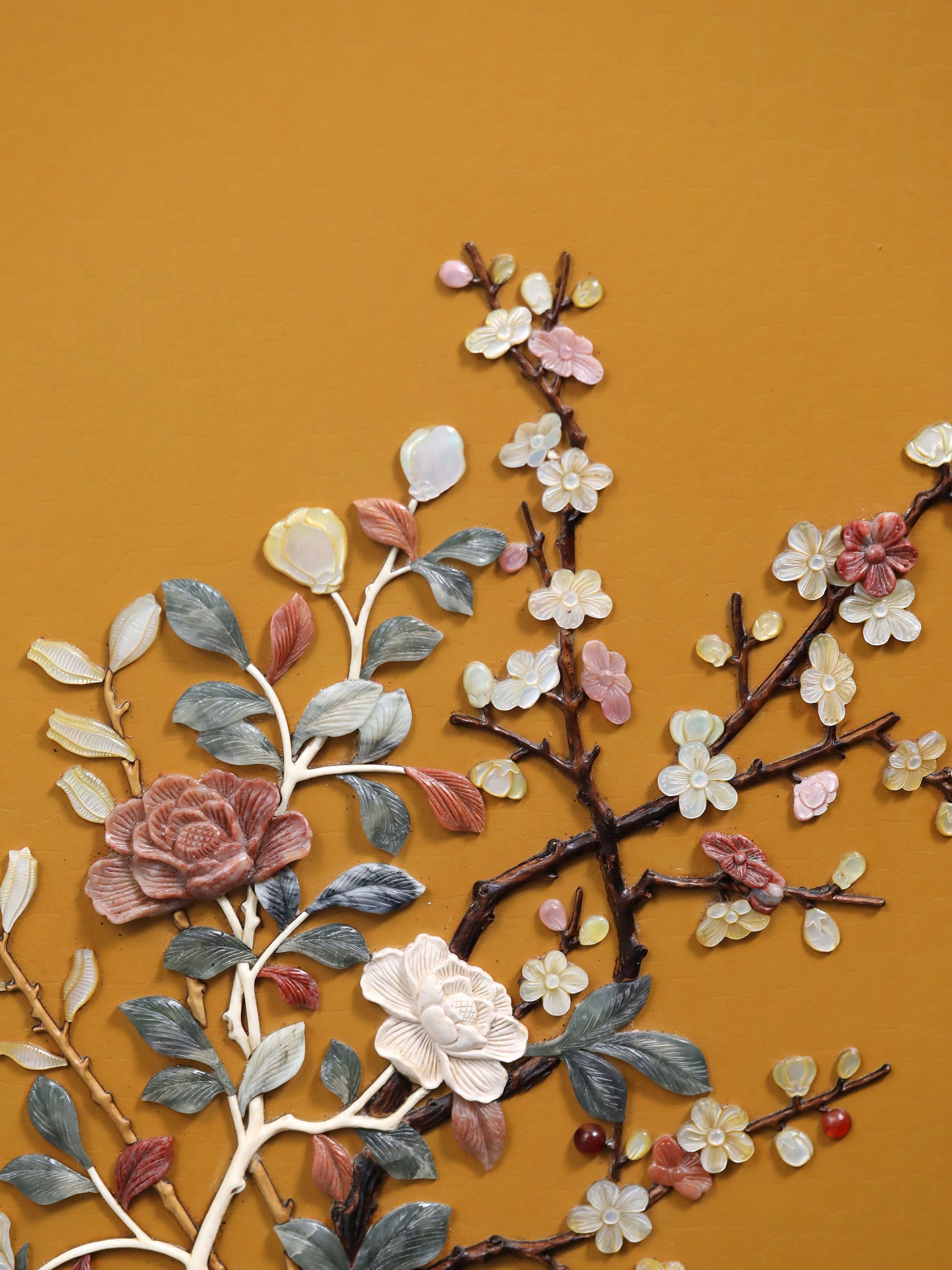 A hanging screen inlaid with precious stones, symbolizing peace and prosperity.