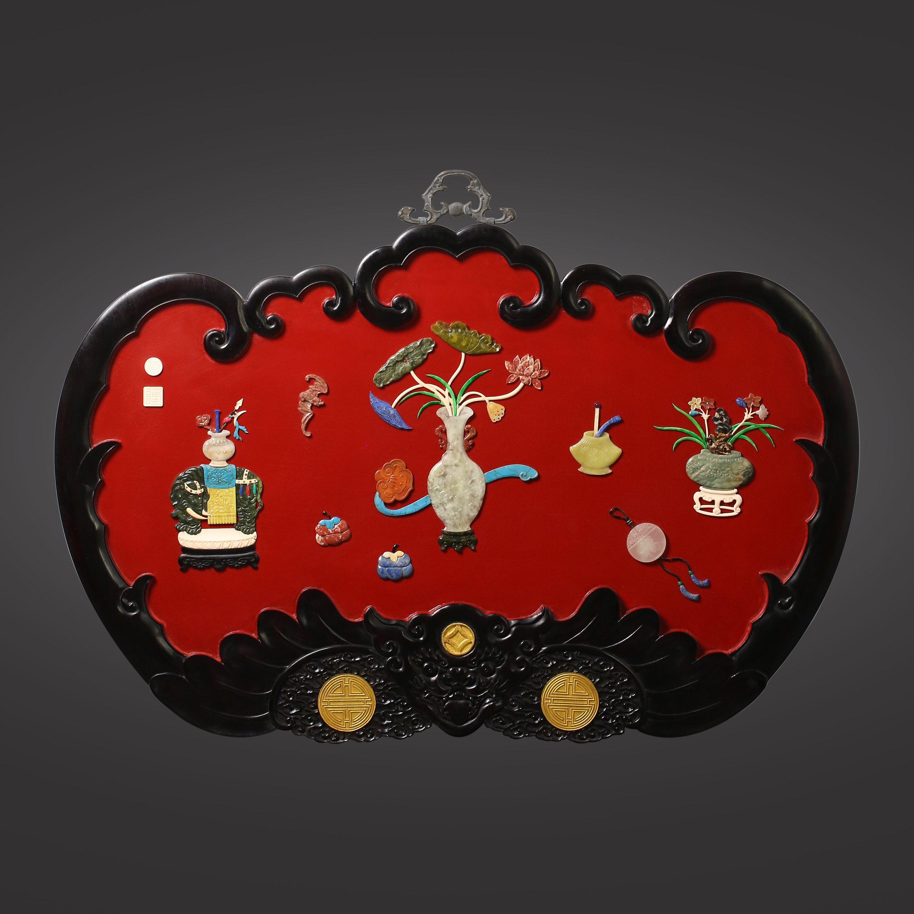A hanging screen inlaid with precious stones, symbolizing peace and prosperity.