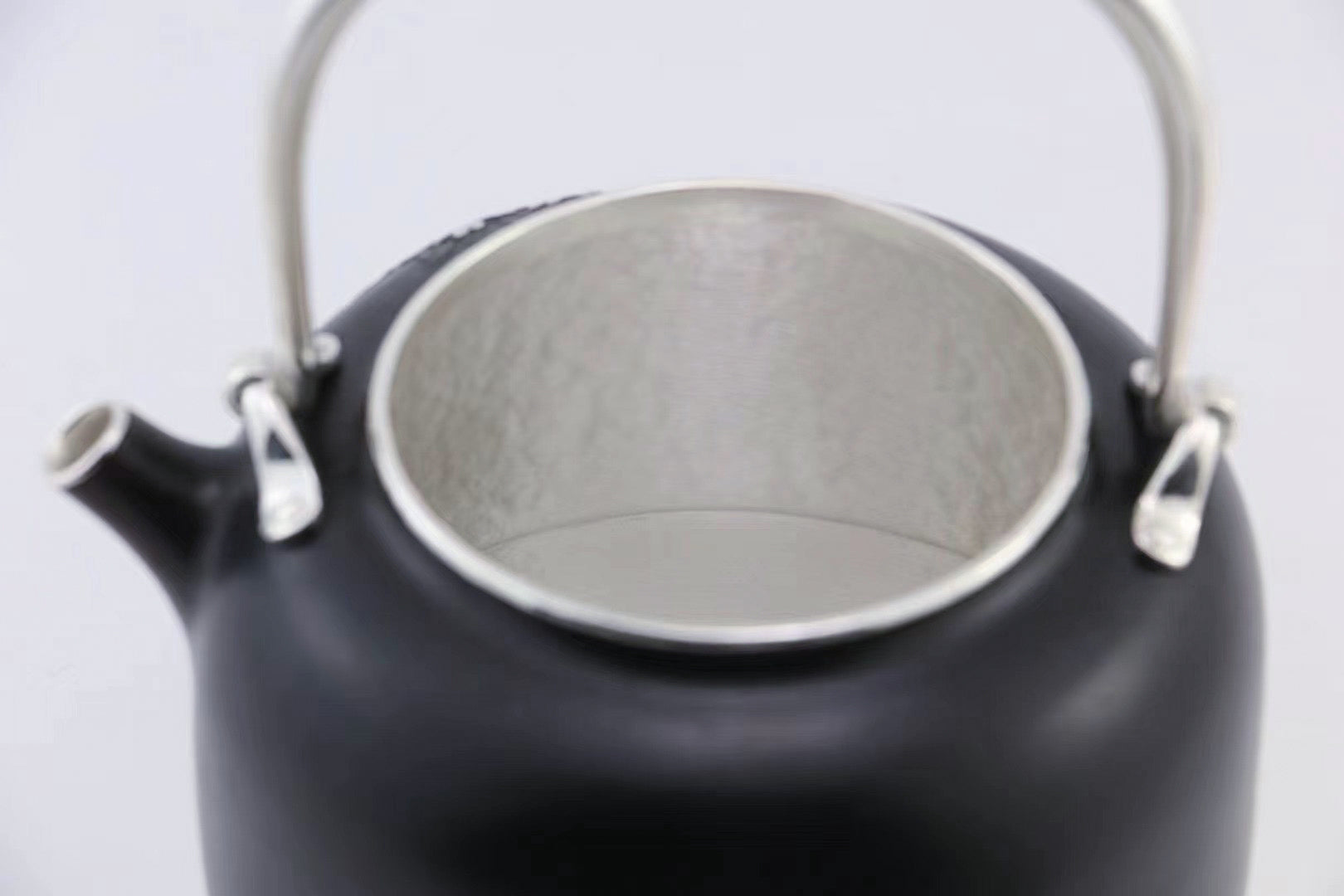 Iron-clad silver flower and bird inlaid gold and silver teapot