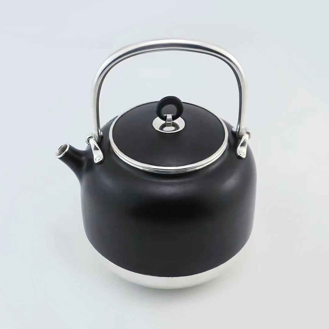 Iron-clad silver flower and bird inlaid gold and silver teapot