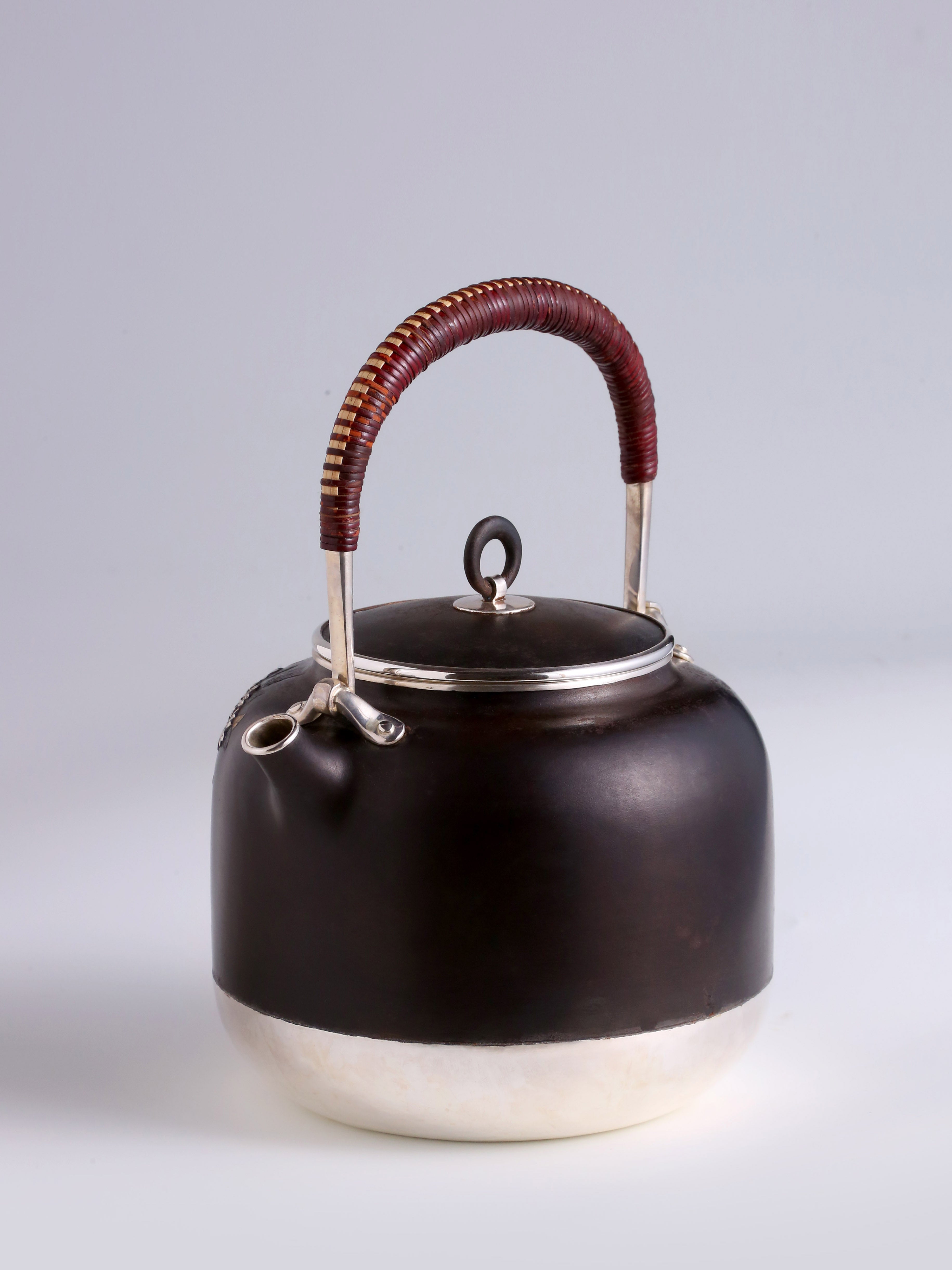 Iron-clad silver flower and bird inlaid gold and silver teapot