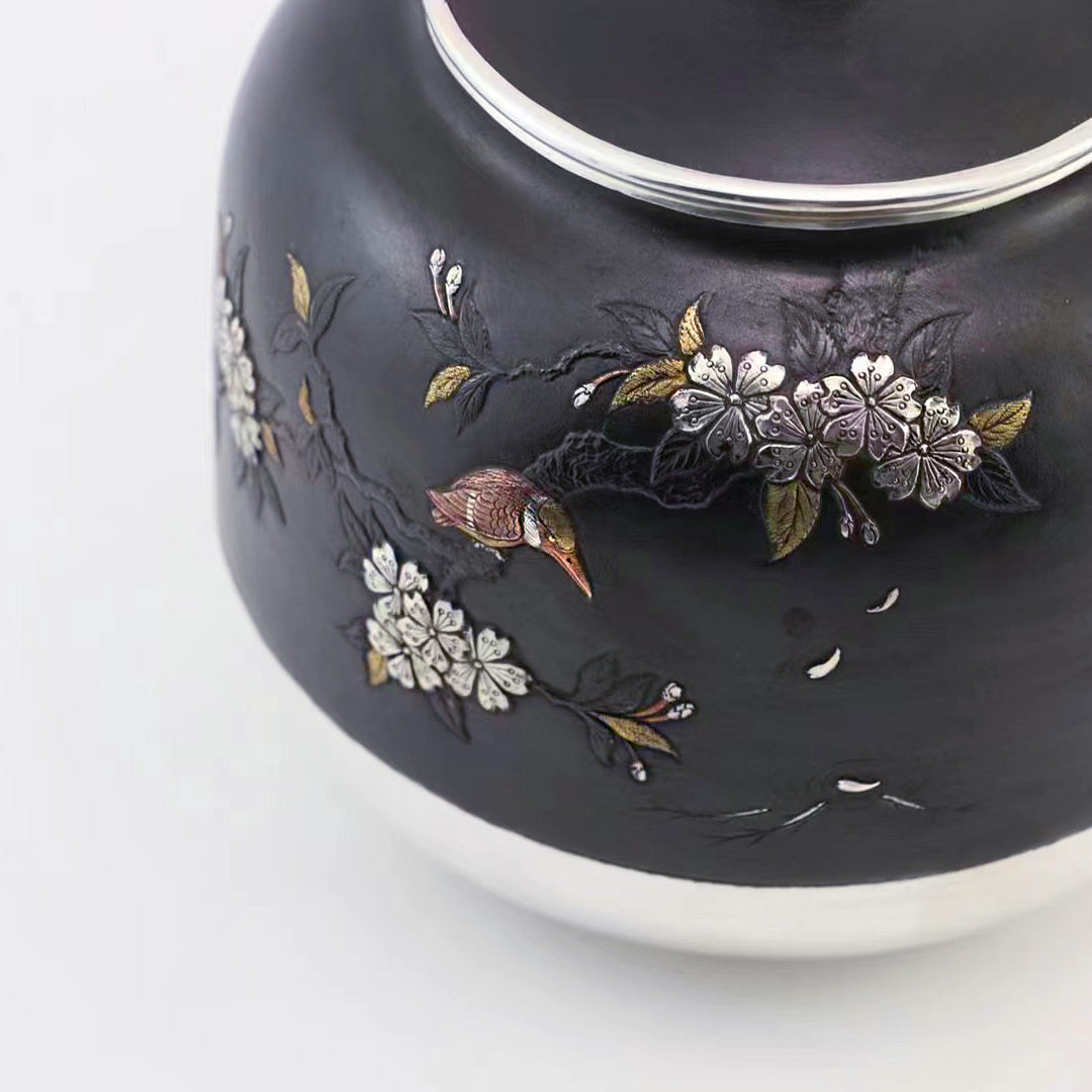 Iron-clad silver flower and bird inlaid gold and silver teapot
