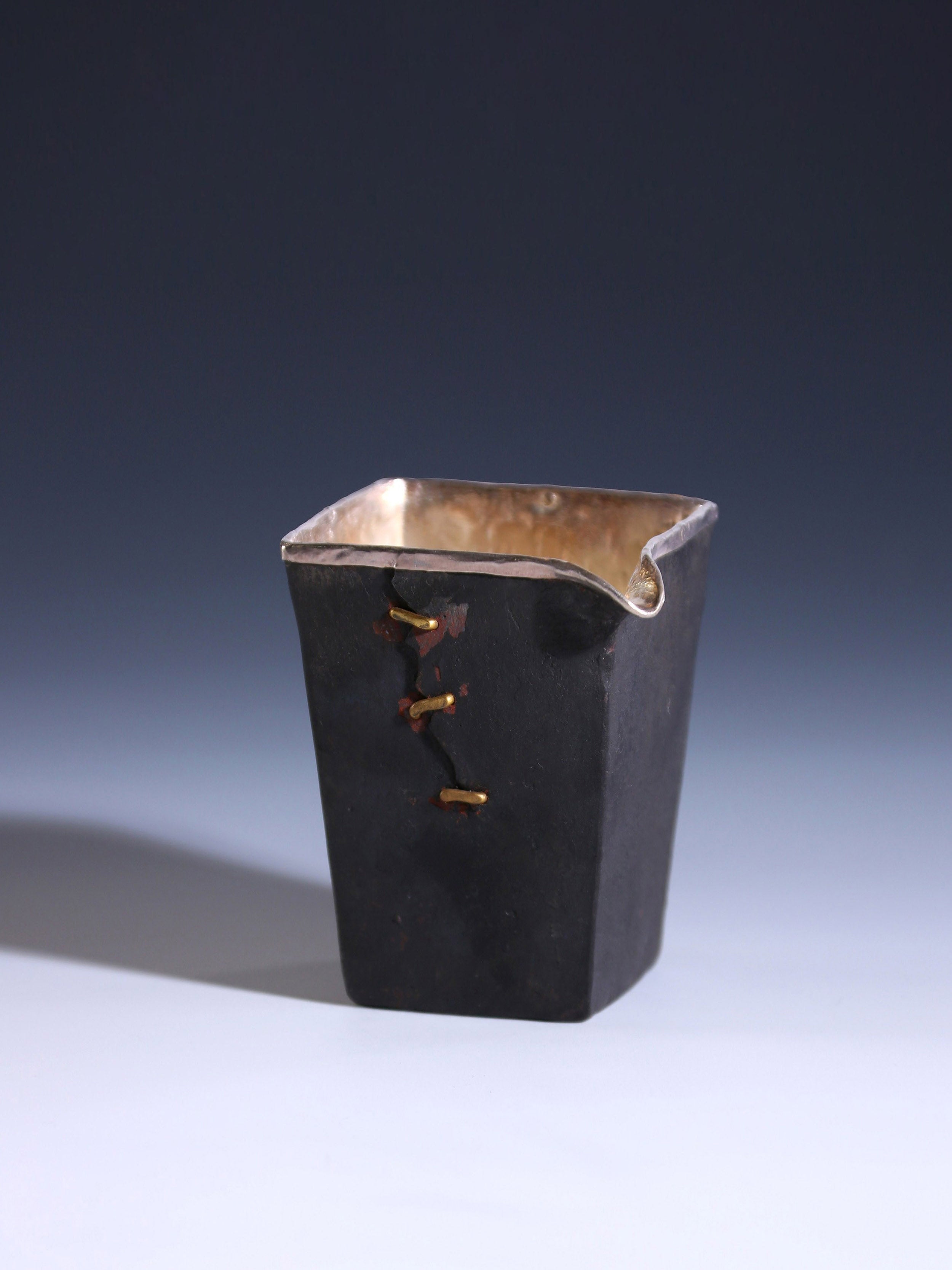 Iron-clad silver-studded fair cup