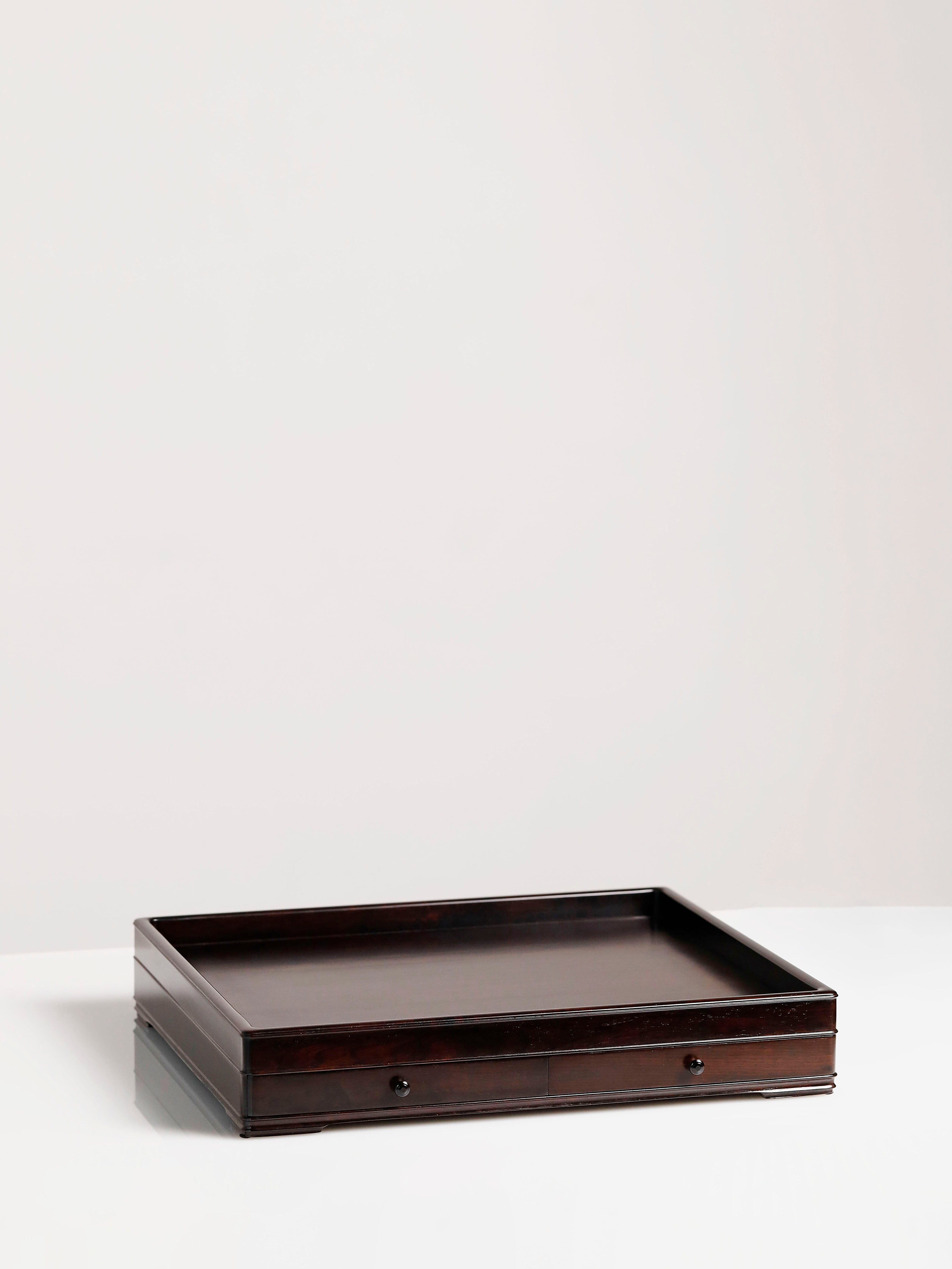 A plain-faced plate inlaid with burl wood on small-leaf red sandalwood, and a plate inlaid with purple sandalwood.