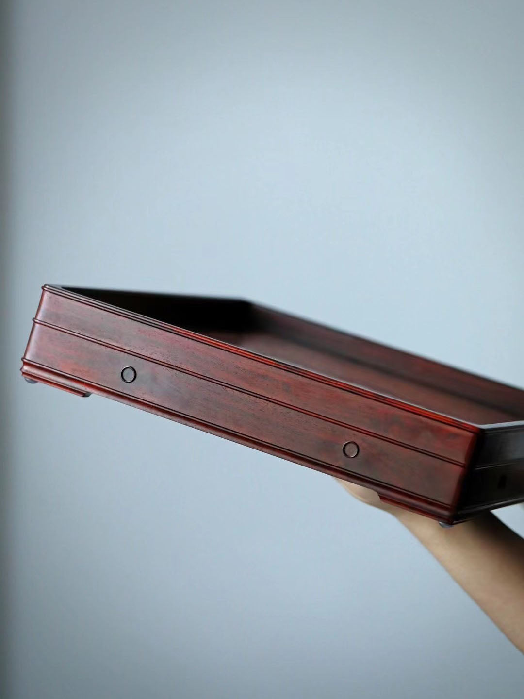 A plain-faced plate inlaid with burl wood on small-leaf red sandalwood, and a plate inlaid with purple sandalwood.