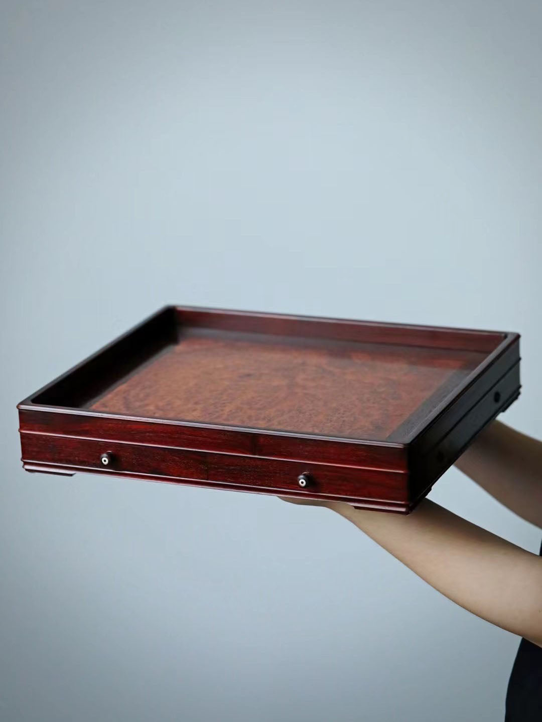 A plain-faced plate inlaid with burl wood on small-leaf red sandalwood, and a plate inlaid with purple sandalwood.